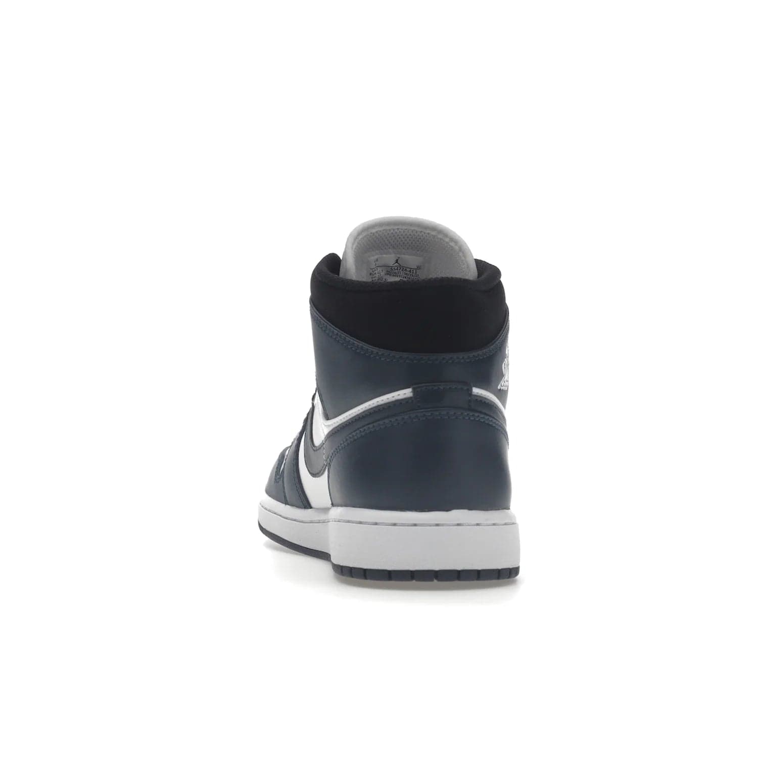Jordan 1 Mid Armory Navy - Image 27 - Only at www.BallersClubKickz.com - The Jordan 1 Mid Armory Navy: classic basketball sneaker with soft white leather upper, deep navy blue overlays, and black leather ankle detailing. Iconic style with Jordan Wings logo and Jumpman label.