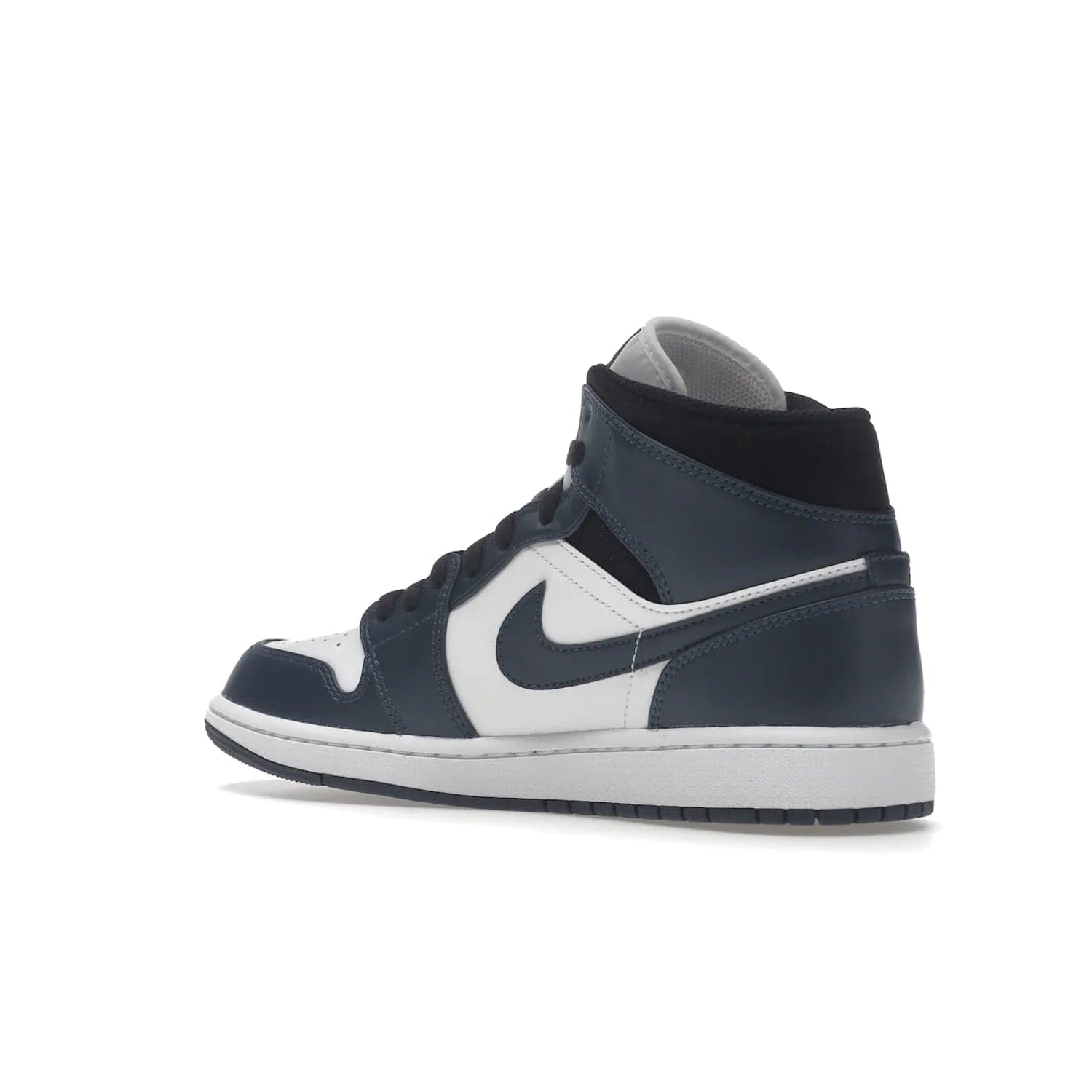 Jordan 1 Mid Armory Navy - Image 23 - Only at www.BallersClubKickz.com - The Jordan 1 Mid Armory Navy: classic basketball sneaker with soft white leather upper, deep navy blue overlays, and black leather ankle detailing. Iconic style with Jordan Wings logo and Jumpman label.