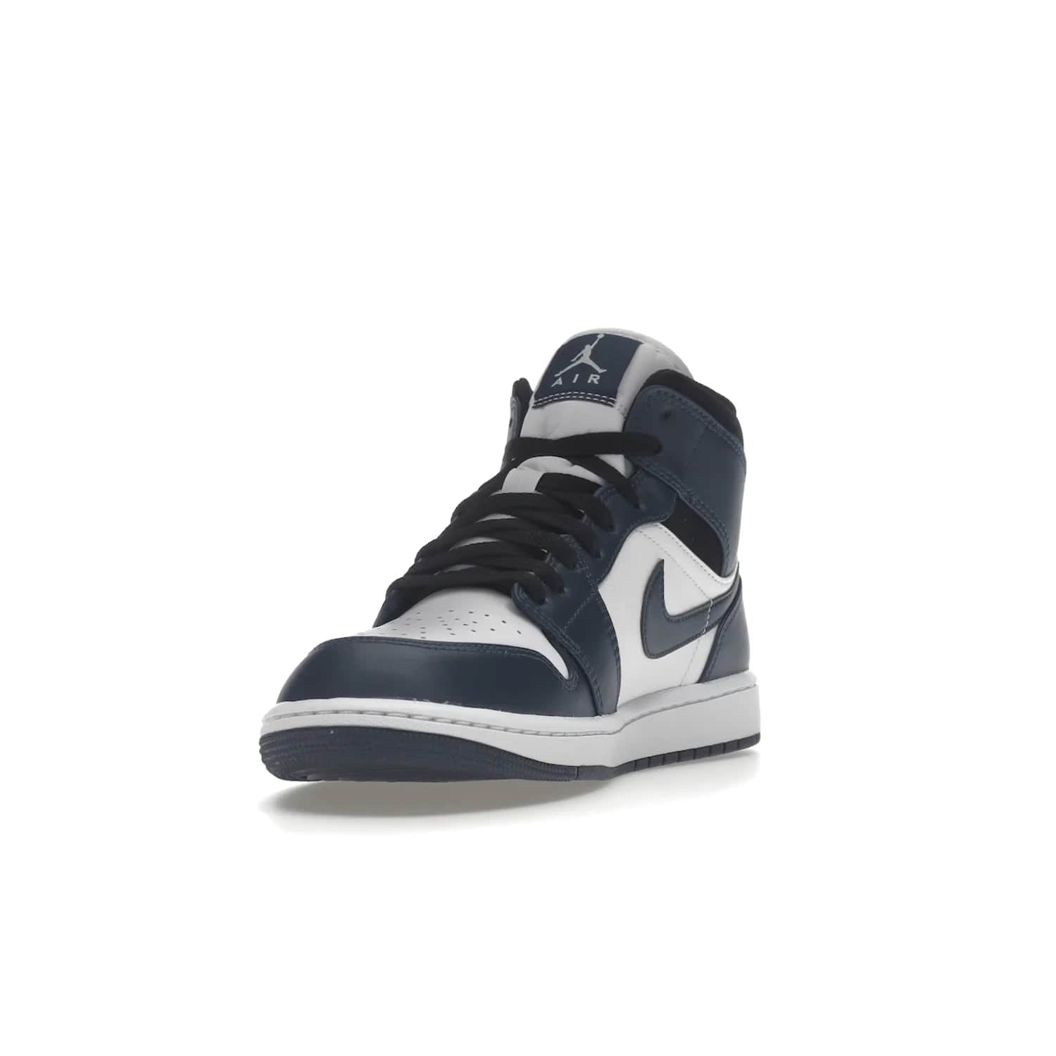 Jordan 1 Mid Armory Navy - Image 13 - Only at www.BallersClubKickz.com - The Jordan 1 Mid Armory Navy: classic basketball sneaker with soft white leather upper, deep navy blue overlays, and black leather ankle detailing. Iconic style with Jordan Wings logo and Jumpman label.