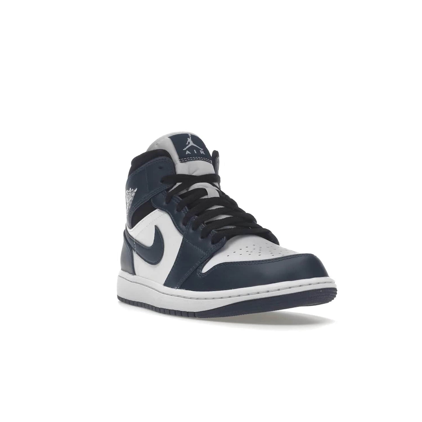 Jordan 1 Mid Armory Navy - Image 7 - Only at www.BallersClubKickz.com - The Jordan 1 Mid Armory Navy: classic basketball sneaker with soft white leather upper, deep navy blue overlays, and black leather ankle detailing. Iconic style with Jordan Wings logo and Jumpman label.