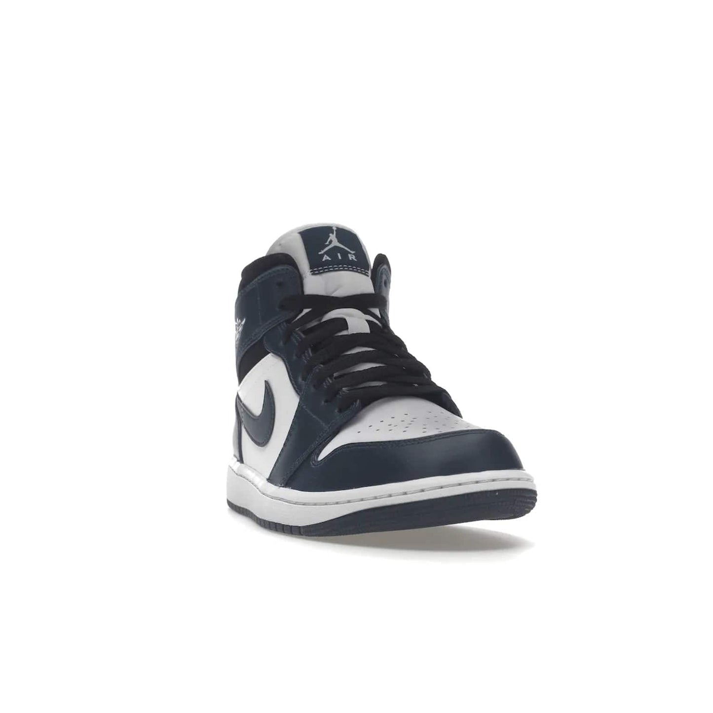 Jordan 1 Mid Armory Navy - Image 8 - Only at www.BallersClubKickz.com - The Jordan 1 Mid Armory Navy: classic basketball sneaker with soft white leather upper, deep navy blue overlays, and black leather ankle detailing. Iconic style with Jordan Wings logo and Jumpman label.