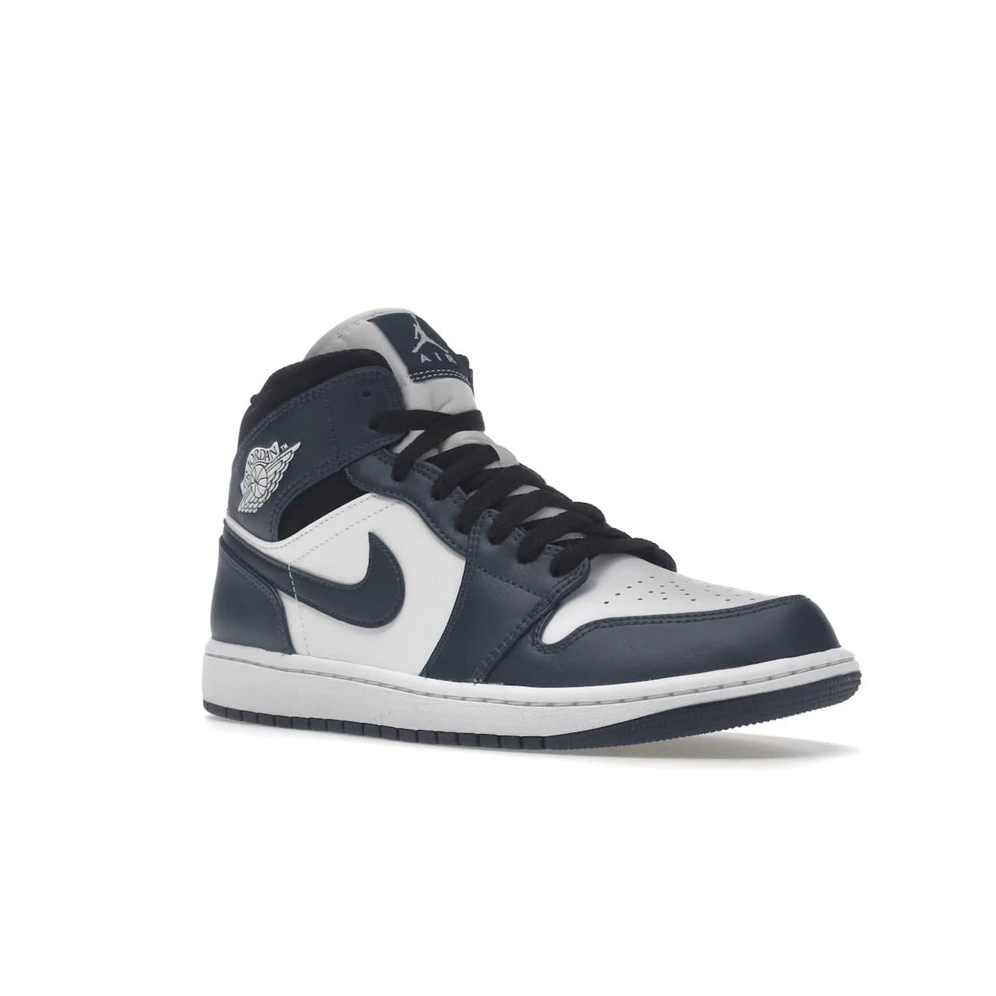 Jordan 1 Mid Armory Navy - Image 5 - Only at www.BallersClubKickz.com - The Jordan 1 Mid Armory Navy: classic basketball sneaker with soft white leather upper, deep navy blue overlays, and black leather ankle detailing. Iconic style with Jordan Wings logo and Jumpman label.