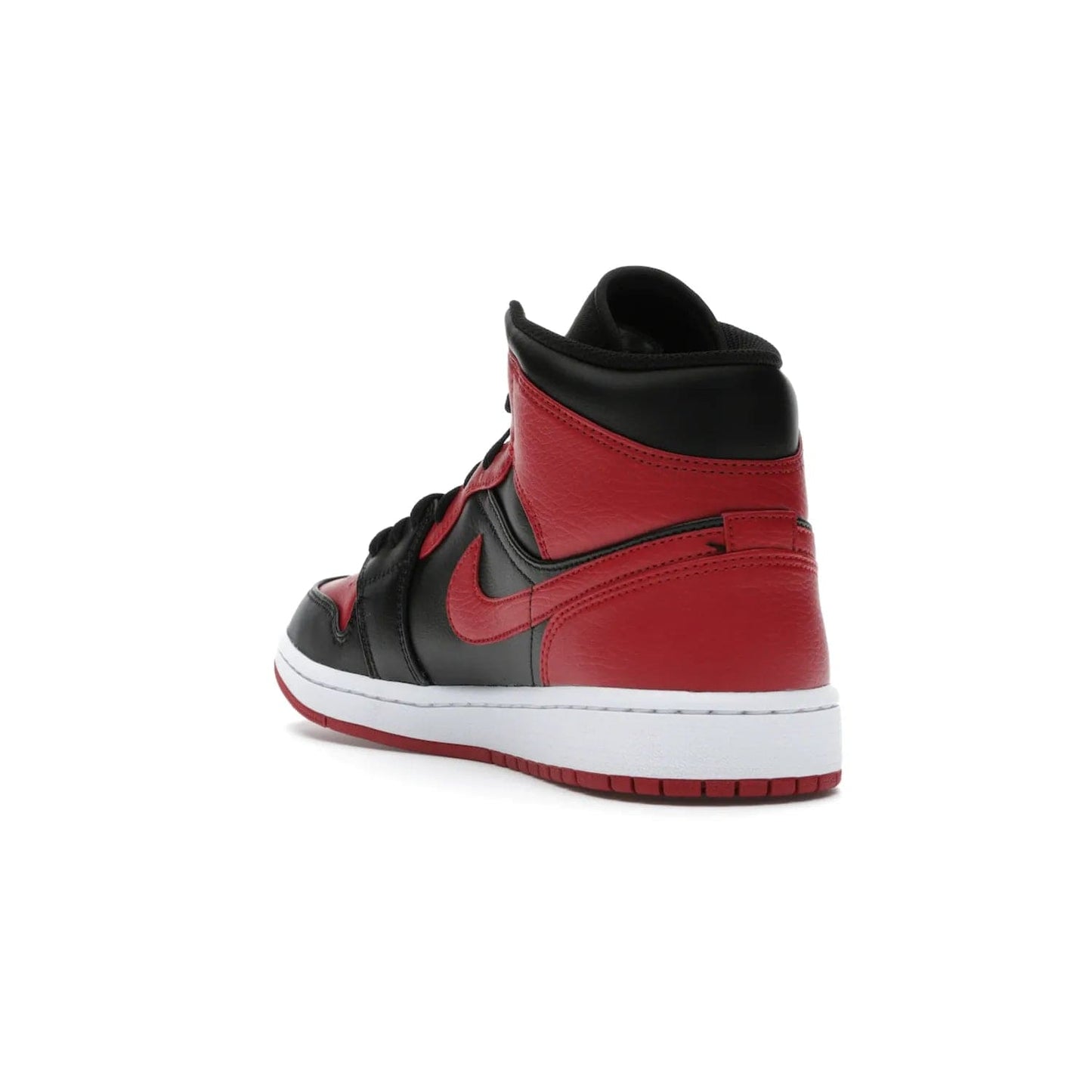 Jordan 1 Mid Banned (2020) - Image 25 - Only at www.BallersClubKickz.com - The Air Jordan 1 Mid Banned (2020) brings a modern twist to the classic Banned colorway. Features full-grain black and red leather uppers, red leather around the toe, collar, heel, & Swoosh. Release November 2021 for $110.