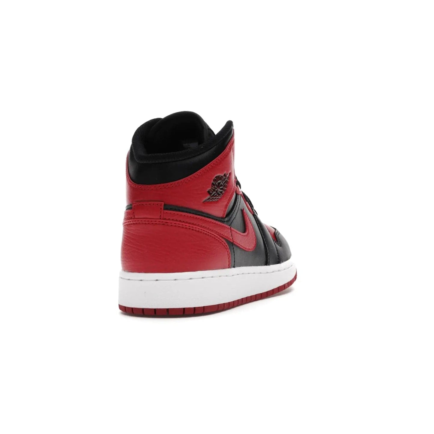 Jordan 1 Mid Banned (2020) (GS) - Image 30 - Only at www.BallersClubKickz.com - Introducing Kids Air Jordan 1 Mid Banned 2020: Michael Jordan's iconic signature shoe in a mid-top take with luxurious leather upper, black color palette & contrasting white midsole & red outsole. Released in Nov 2020 to wide fan reception.