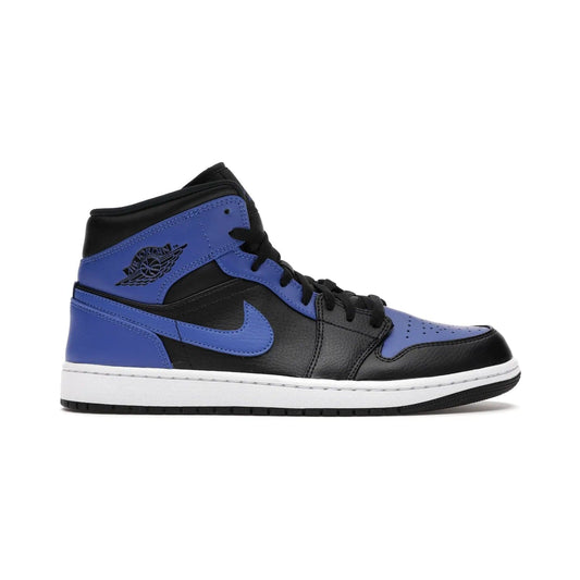 Jordan 1 Mid Hyper Royal Tumbled Leather - Image 1 - Only at www.BallersClubKickz.com - Iconic colorway of the Air Jordan 1 Mid Black Royal Tumbled Leather. Features a black tumbled leather upper, royal blue leather overlays, white midsole & black rubber outsole. Released December 2020. Adds premium style to any collection.