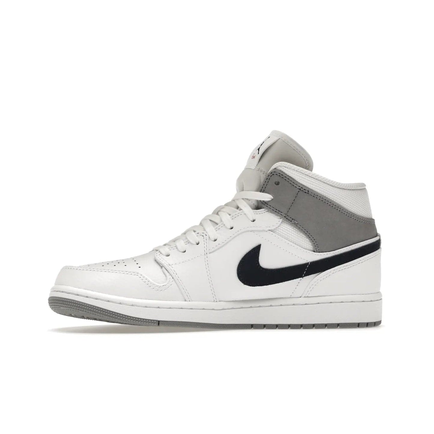 Jordan 1 Mid Paris White - Image 18 - Only at www.BallersClubKickz.com - Snag the Air Jordan 1 Mid Paris White to add a statement of sophistication to any sneaker collection. Featuring Nike swoosh logo in midnight navy suede and Jumpman symbol in University Red.