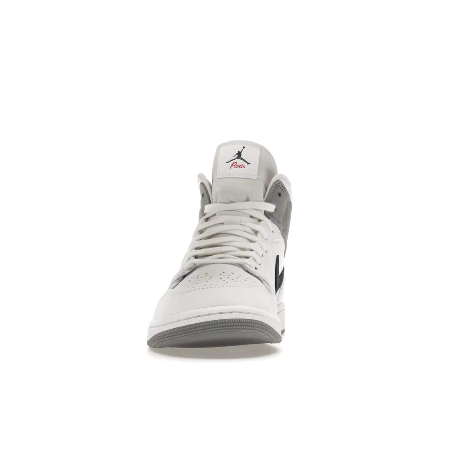 Jordan 1 Mid Paris White - Image 11 - Only at www.BallersClubKickz.com - Snag the Air Jordan 1 Mid Paris White to add a statement of sophistication to any sneaker collection. Featuring Nike swoosh logo in midnight navy suede and Jumpman symbol in University Red.