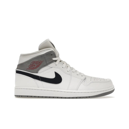 Jordan 1 Mid Paris White - Image 1 - Only at www.BallersClubKickz.com - Snag the Air Jordan 1 Mid Paris White to add a statement of sophistication to any sneaker collection. Featuring Nike swoosh logo in midnight navy suede and Jumpman symbol in University Red.