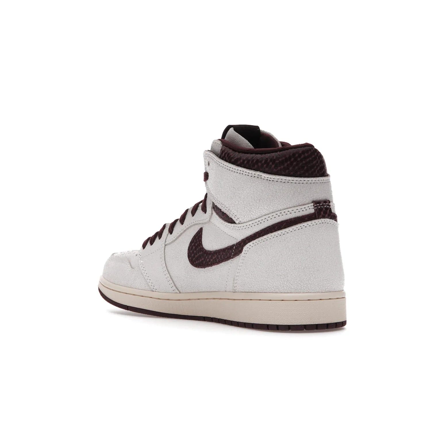 Jordan 1 Retro High OG A Ma Maniére - Image 24 - Only at www.BallersClubKickz.com - Luxury meets style with the Air Jordan 1 A Ma Maniére. Premium leather, reptilian-textured leather collars and Swooshes, quilted lining, and yellowed soles come together to create a vintage yet modern sneaker, perfect for any occasion. Released in November 2021.