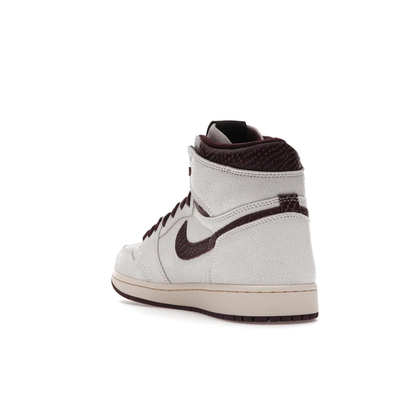 Jordan 1 Retro High OG A Ma Maniére - Image 25 - Only at www.BallersClubKickz.com - Luxury meets style with the Air Jordan 1 A Ma Maniére. Premium leather, reptilian-textured leather collars and Swooshes, quilted lining, and yellowed soles come together to create a vintage yet modern sneaker, perfect for any occasion. Released in November 2021.