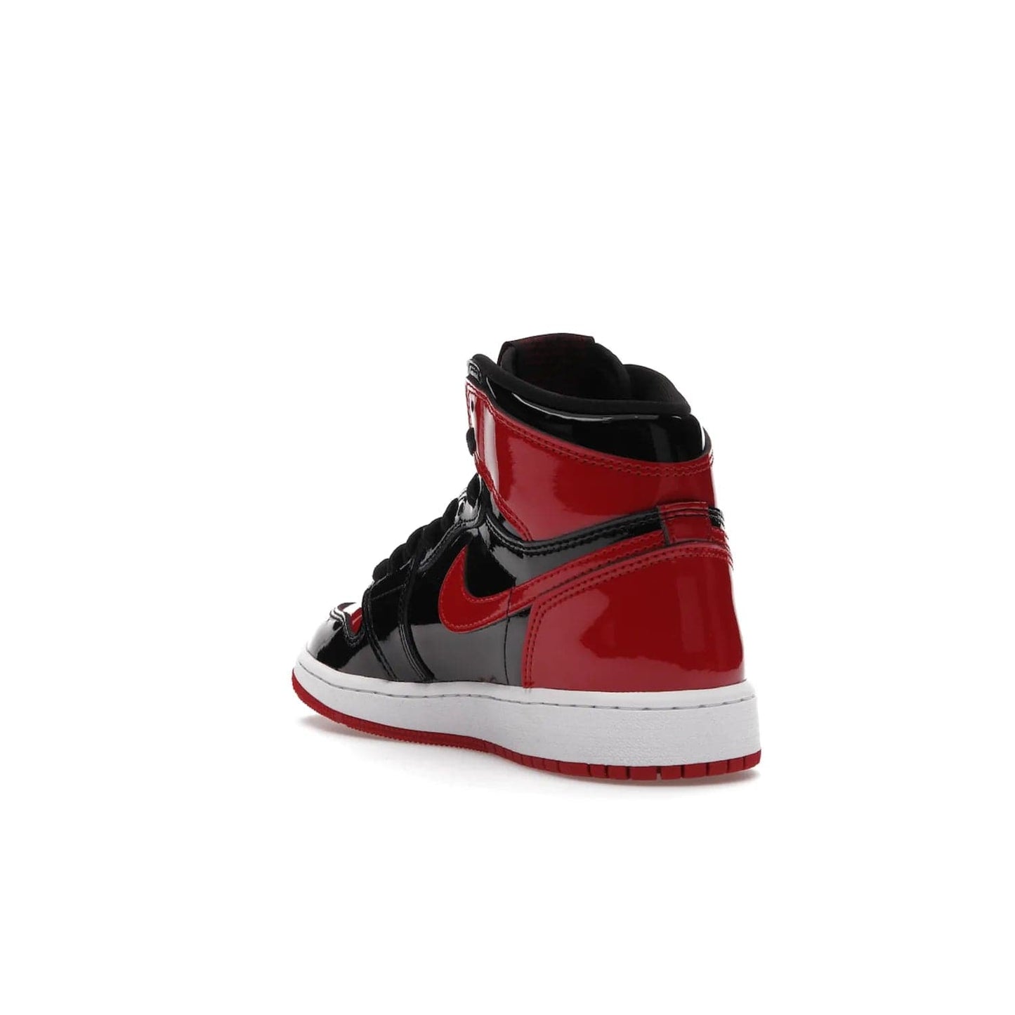 Jordan 1 Retro High OG Patent Bred (GS) - Image 25 - Only at www.BallersClubKickz.com - Upgrade your sneaker game with the iconic Air Jordan 1 Retro High OG Bred Patent GS. Crafted with premium patent leather and basketball-inspired details for a classic look, they also feature an encapsulated Air-sole cushioning and enhanced red rubber outsole. Don't miss this timeless sneaker with a striking black, white, and varsity red colorway, dropping December 2021.