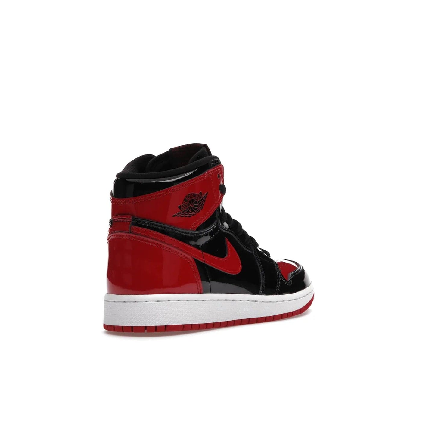 Jordan 1 Retro High OG Patent Bred (GS) - Image 32 - Only at www.BallersClubKickz.com - Upgrade your sneaker game with the iconic Air Jordan 1 Retro High OG Bred Patent GS. Crafted with premium patent leather and basketball-inspired details for a classic look, they also feature an encapsulated Air-sole cushioning and enhanced red rubber outsole. Don't miss this timeless sneaker with a striking black, white, and varsity red colorway, dropping December 2021.