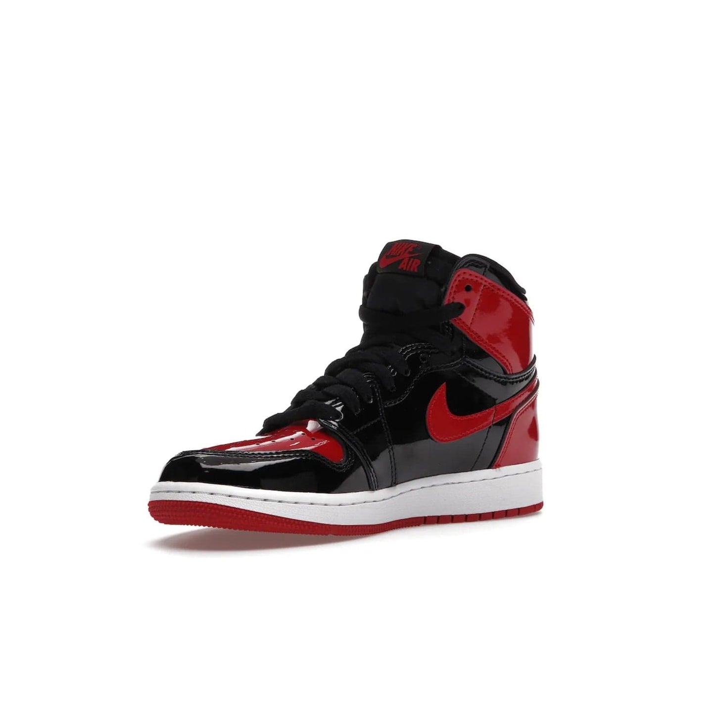 Jordan 1 Retro High OG Patent Bred (GS) - Image 15 - Only at www.BallersClubKickz.com - Upgrade your sneaker game with the iconic Air Jordan 1 Retro High OG Bred Patent GS. Crafted with premium patent leather and basketball-inspired details for a classic look, they also feature an encapsulated Air-sole cushioning and enhanced red rubber outsole. Don't miss this timeless sneaker with a striking black, white, and varsity red colorway, dropping December 2021.