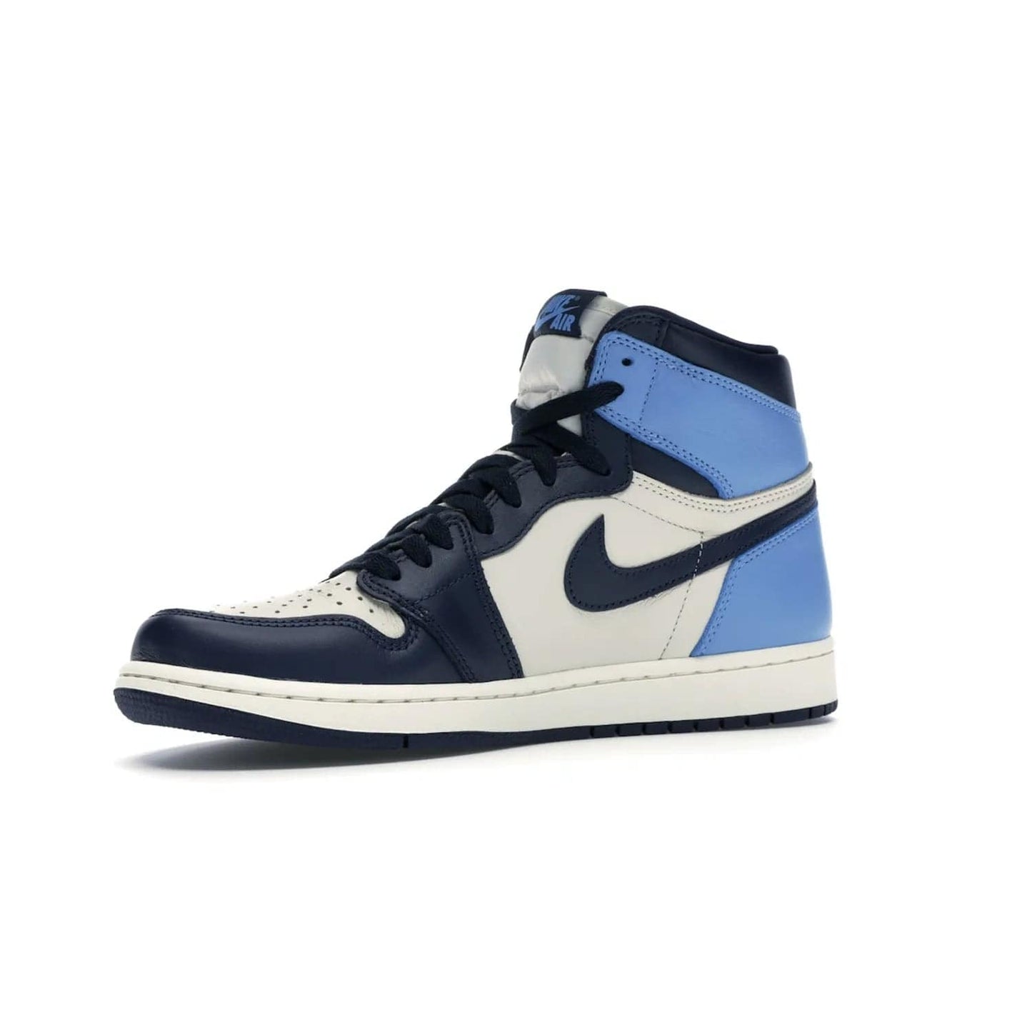 Jordan 1 Retro High Obsidian UNC - Image 16 - Only at www.BallersClubKickz.com - Bring a timeless classic to your wardrobe with the Air Jordan 1 Retro High "Obsidian/University Blue”. A full leather upper combines Obsidian and University Blue detailing for a retro Jordan style. Stitched Jumpman logo pays tribute to UNC. Experience classic style with a timeless sneaker.