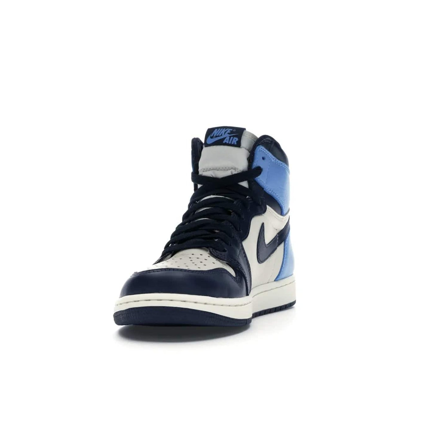 Jordan 1 Retro High Obsidian UNC - Image 12 - Only at www.BallersClubKickz.com - Bring a timeless classic to your wardrobe with the Air Jordan 1 Retro High "Obsidian/University Blue”. A full leather upper combines Obsidian and University Blue detailing for a retro Jordan style. Stitched Jumpman logo pays tribute to UNC. Experience classic style with a timeless sneaker.