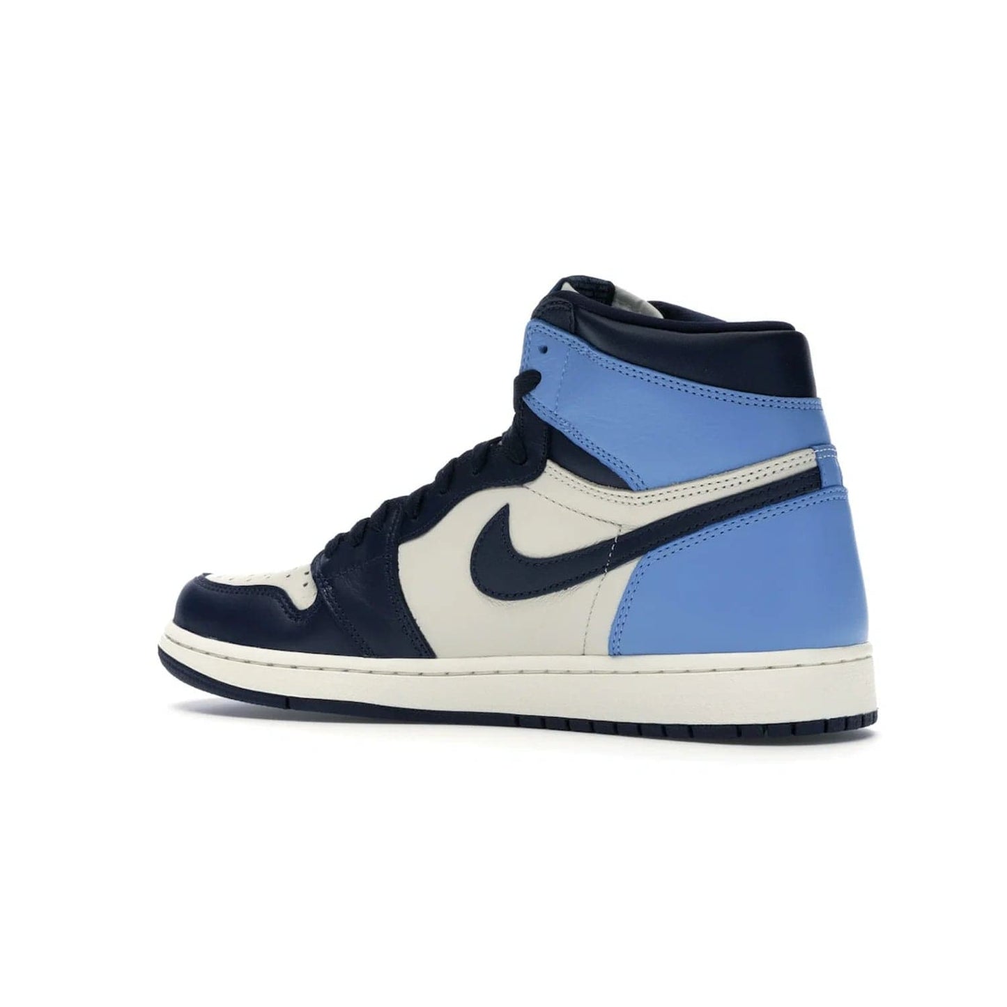 Jordan 1 Retro High Obsidian UNC - Image 22 - Only at www.BallersClubKickz.com - Bring a timeless classic to your wardrobe with the Air Jordan 1 Retro High "Obsidian/University Blue”. A full leather upper combines Obsidian and University Blue detailing for a retro Jordan style. Stitched Jumpman logo pays tribute to UNC. Experience classic style with a timeless sneaker.