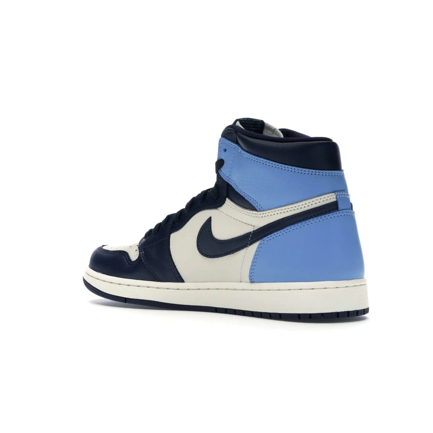 Jordan 1 Retro High Obsidian UNC - Image 23 - Only at www.BallersClubKickz.com - Bring a timeless classic to your wardrobe with the Air Jordan 1 Retro High "Obsidian/University Blue”. A full leather upper combines Obsidian and University Blue detailing for a retro Jordan style. Stitched Jumpman logo pays tribute to UNC. Experience classic style with a timeless sneaker.