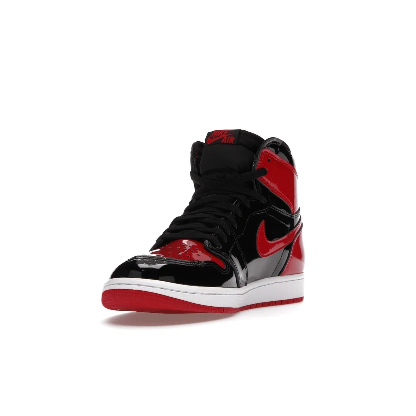 Jordan 1 Retro High OG Patent Bred - Image 13 - Only at www.BallersClubKickz.com - Introducing Air Jordan 1 Retro High OG Patent Bred - sleek patent leather upper, signature weaved Nike Air tongue and classic Wings logo on collar. Red and white sole complete signature look. Releasing December 2021 - perfect retro edition for holidays.