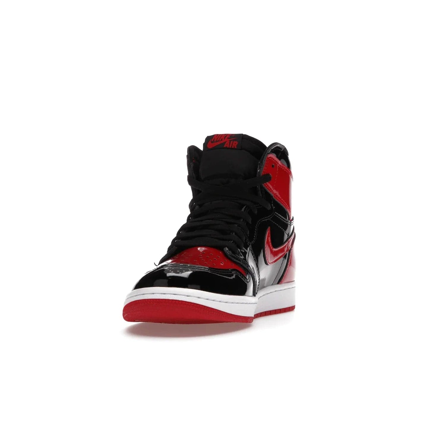 Jordan 1 Retro High OG Patent Bred - Image 12 - Only at www.BallersClubKickz.com - Introducing Air Jordan 1 Retro High OG Patent Bred - sleek patent leather upper, signature weaved Nike Air tongue and classic Wings logo on collar. Red and white sole complete signature look. Releasing December 2021 - perfect retro edition for holidays.