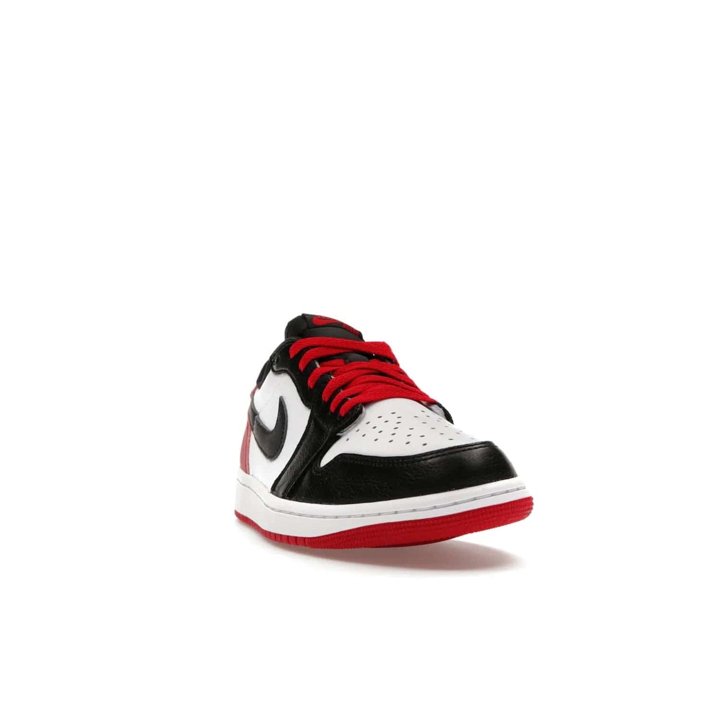 Jordan 1 Retro Low OG Black Toe (2023) - Image 8 - Only at www.BallersClubKickz.com - Upgrade your wardrobe with the Jordan 1 Retro Low OG Black Toe featuring a classic black and white upper and dynamic red heel counter. Eye-catching white midsole and iconic black Swoosh and Wings complete the timeless yet modern look. Shop now to own this iconic shoe!