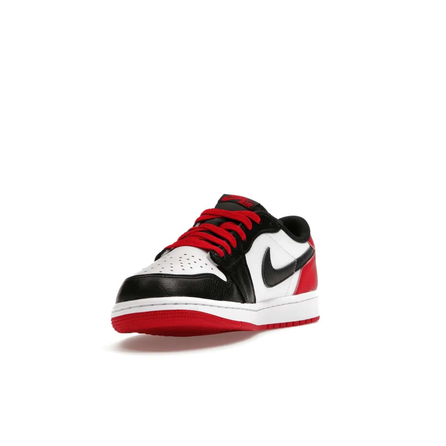 Jordan 1 Retro Low OG Black Toe (2023) - Image 13 - Only at www.BallersClubKickz.com - Upgrade your wardrobe with the Jordan 1 Retro Low OG Black Toe featuring a classic black and white upper and dynamic red heel counter. Eye-catching white midsole and iconic black Swoosh and Wings complete the timeless yet modern look. Shop now to own this iconic shoe!