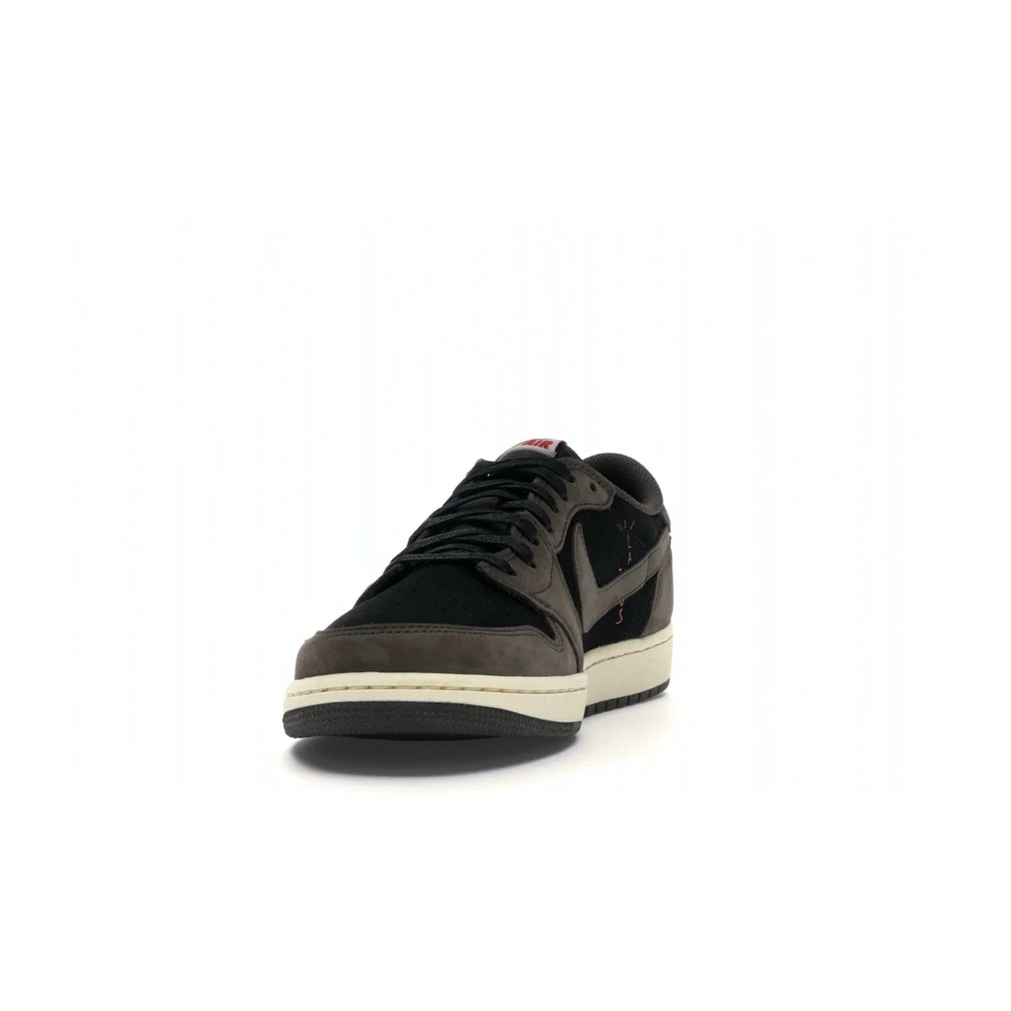Jordan 1 Retro Low OG SP Travis Scott - Image 12 - Only at www.BallersClubKickz.com - The Air Jordan 1 Low Travis Scott combines modern and classic design elements for a stylish look. It features a black upper with dark brown overlays, red accents, sail midsole, and dark brown outsole. Signature touches include a backwards Swoosh logo and “Cactus Jack” inscriptions. Released in July 2019.
