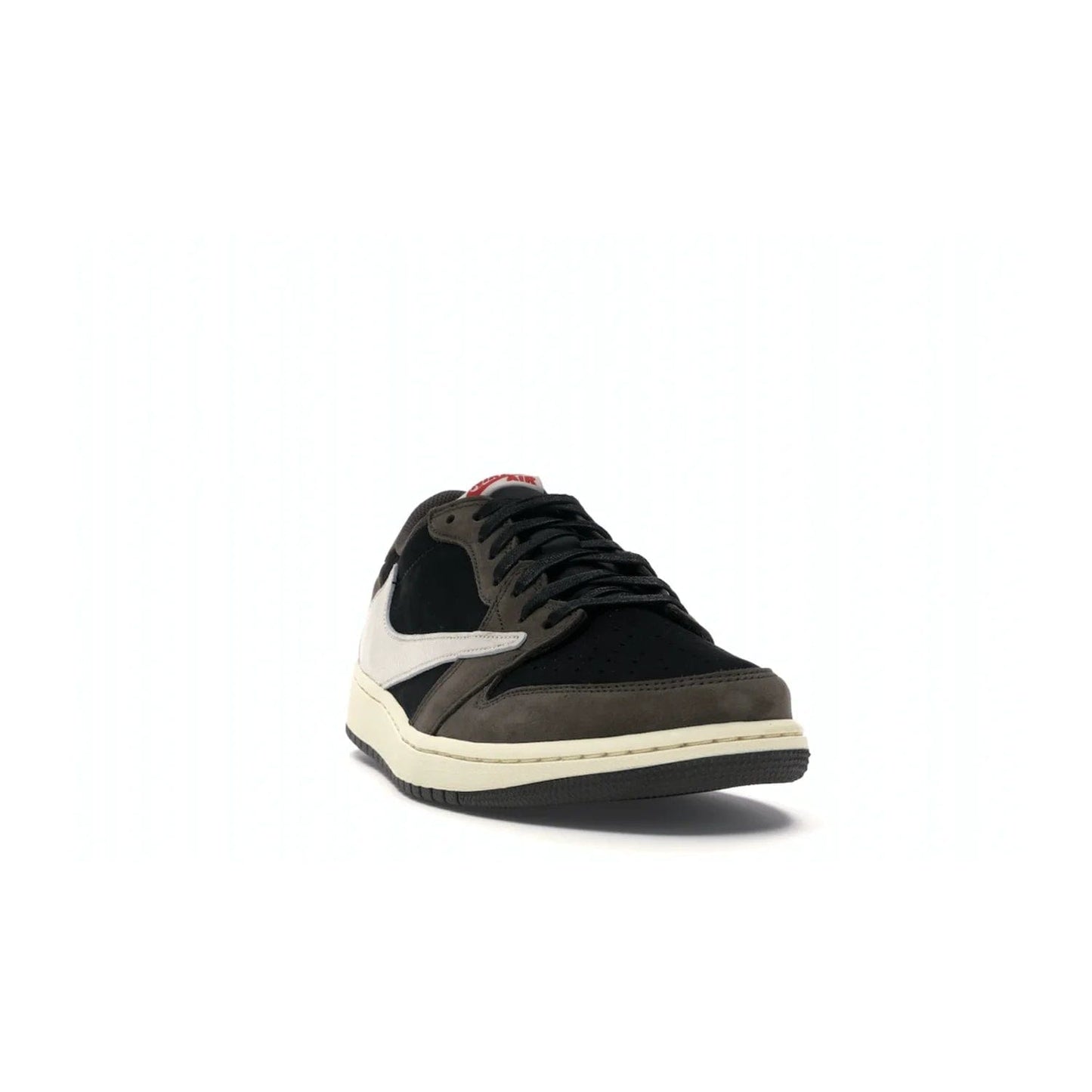 Jordan 1 Retro Low OG SP Travis Scott - Image 8 - Only at www.BallersClubKickz.com - The Air Jordan 1 Low Travis Scott combines modern and classic design elements for a stylish look. It features a black upper with dark brown overlays, red accents, sail midsole, and dark brown outsole. Signature touches include a backwards Swoosh logo and “Cactus Jack” inscriptions. Released in July 2019.