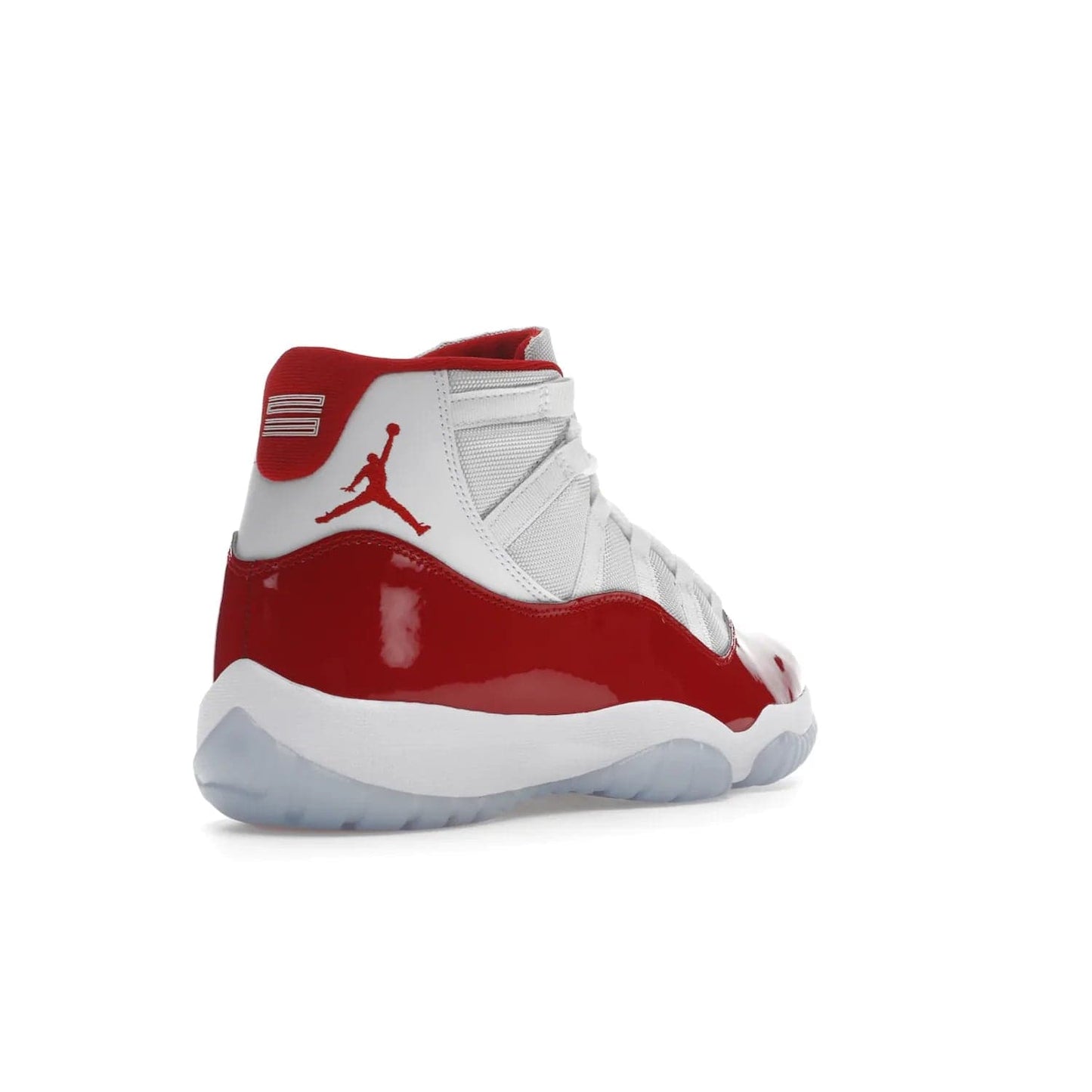 Jordan 11 Retro Cherry (2022) - Image 32 - Only at www.BallersClubKickz.com - The Air Jordan 11 Cherry features classic patent leather with Cherry red accents, icy blue outsole, and debossed 23 on the heel tab. Refresh your sneaker game with this iconic update, available December 10, 2022.