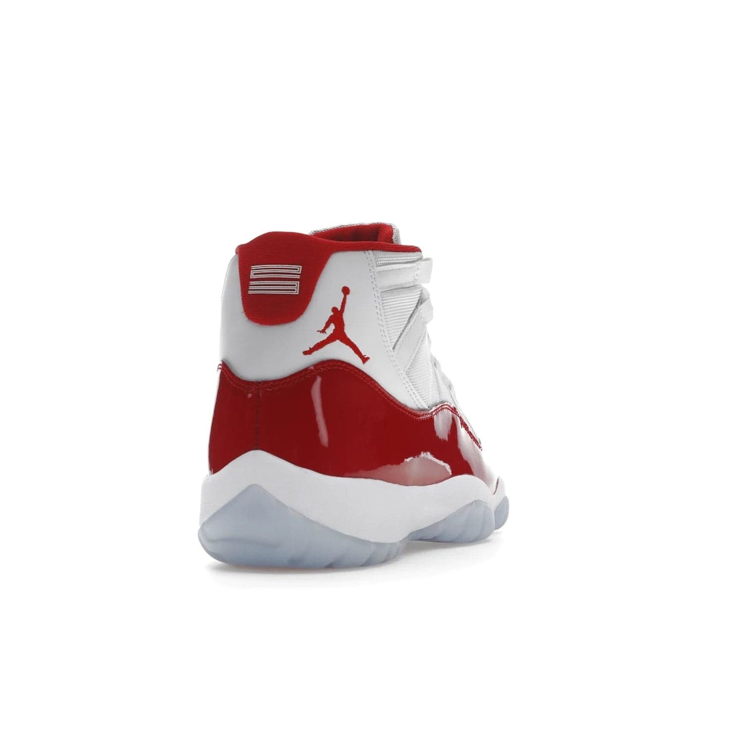 Jordan 11 Retro Cherry (2022) - Image 30 - Only at www.BallersClubKickz.com - The Air Jordan 11 Cherry features classic patent leather with Cherry red accents, icy blue outsole, and debossed 23 on the heel tab. Refresh your sneaker game with this iconic update, available December 10, 2022.