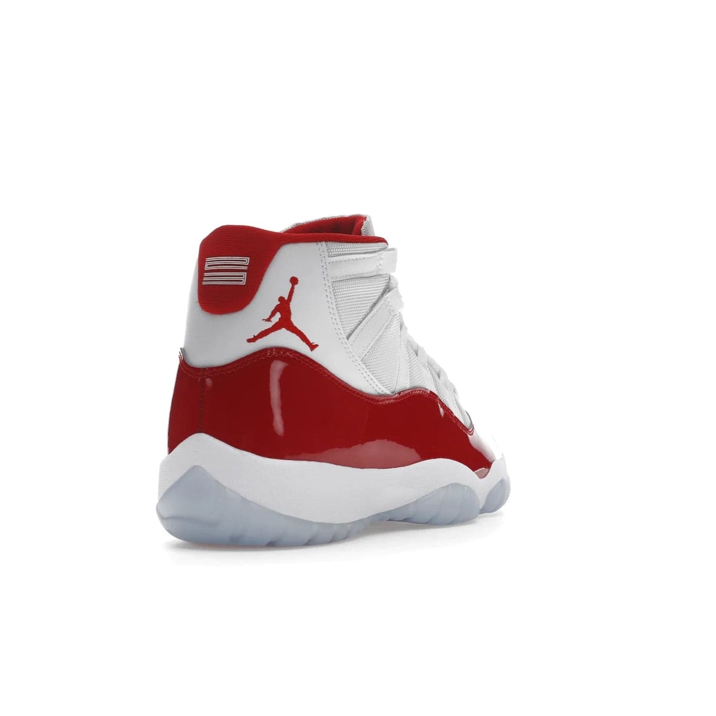 Jordan 11 Retro Cherry (2022) - Image 31 - Only at www.BallersClubKickz.com - The Air Jordan 11 Cherry features classic patent leather with Cherry red accents, icy blue outsole, and debossed 23 on the heel tab. Refresh your sneaker game with this iconic update, available December 10, 2022.