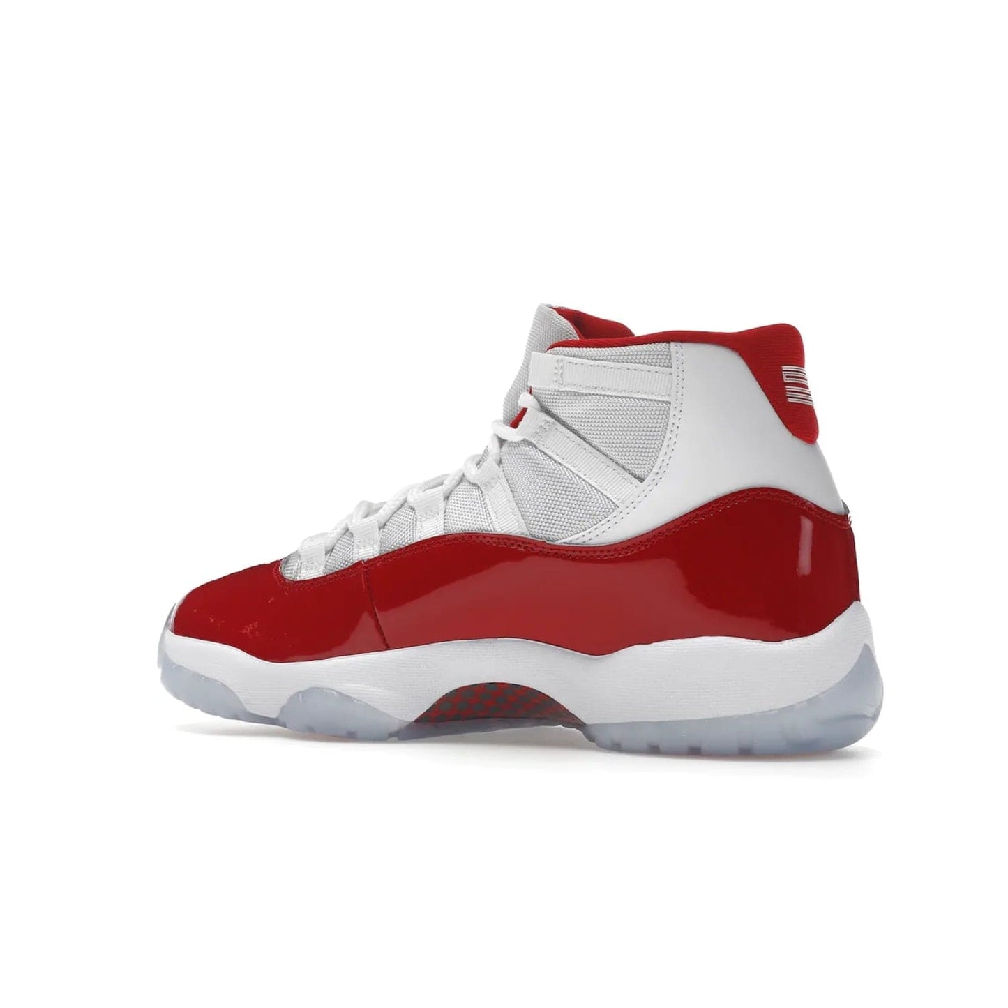 Jordan 11 Retro Cherry (2022) - Image 22 - Only at www.BallersClubKickz.com - The Air Jordan 11 Cherry features classic patent leather with Cherry red accents, icy blue outsole, and debossed 23 on the heel tab. Refresh your sneaker game with this iconic update, available December 10, 2022.
