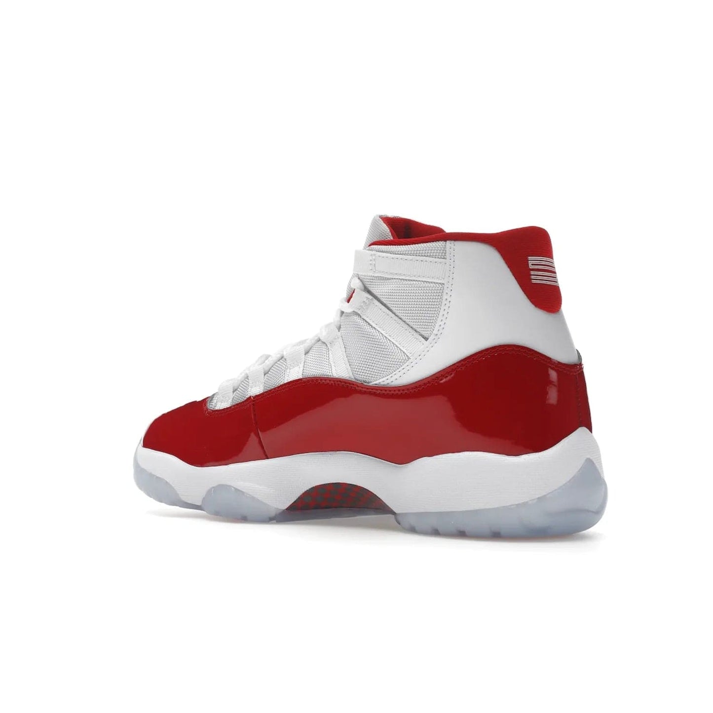 Jordan 11 Retro Cherry (2022) - Image 23 - Only at www.BallersClubKickz.com - The Air Jordan 11 Cherry features classic patent leather with Cherry red accents, icy blue outsole, and debossed 23 on the heel tab. Refresh your sneaker game with this iconic update, available December 10, 2022.