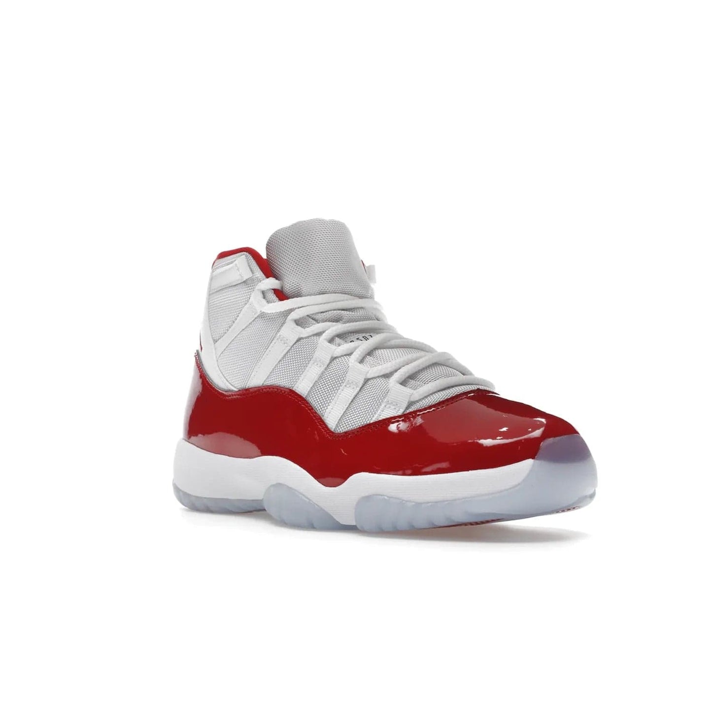 Jordan 11 Retro Cherry (2022) - Image 6 - Only at www.BallersClubKickz.com - The Air Jordan 11 Cherry features classic patent leather with Cherry red accents, icy blue outsole, and debossed 23 on the heel tab. Refresh your sneaker game with this iconic update, available December 10, 2022.
