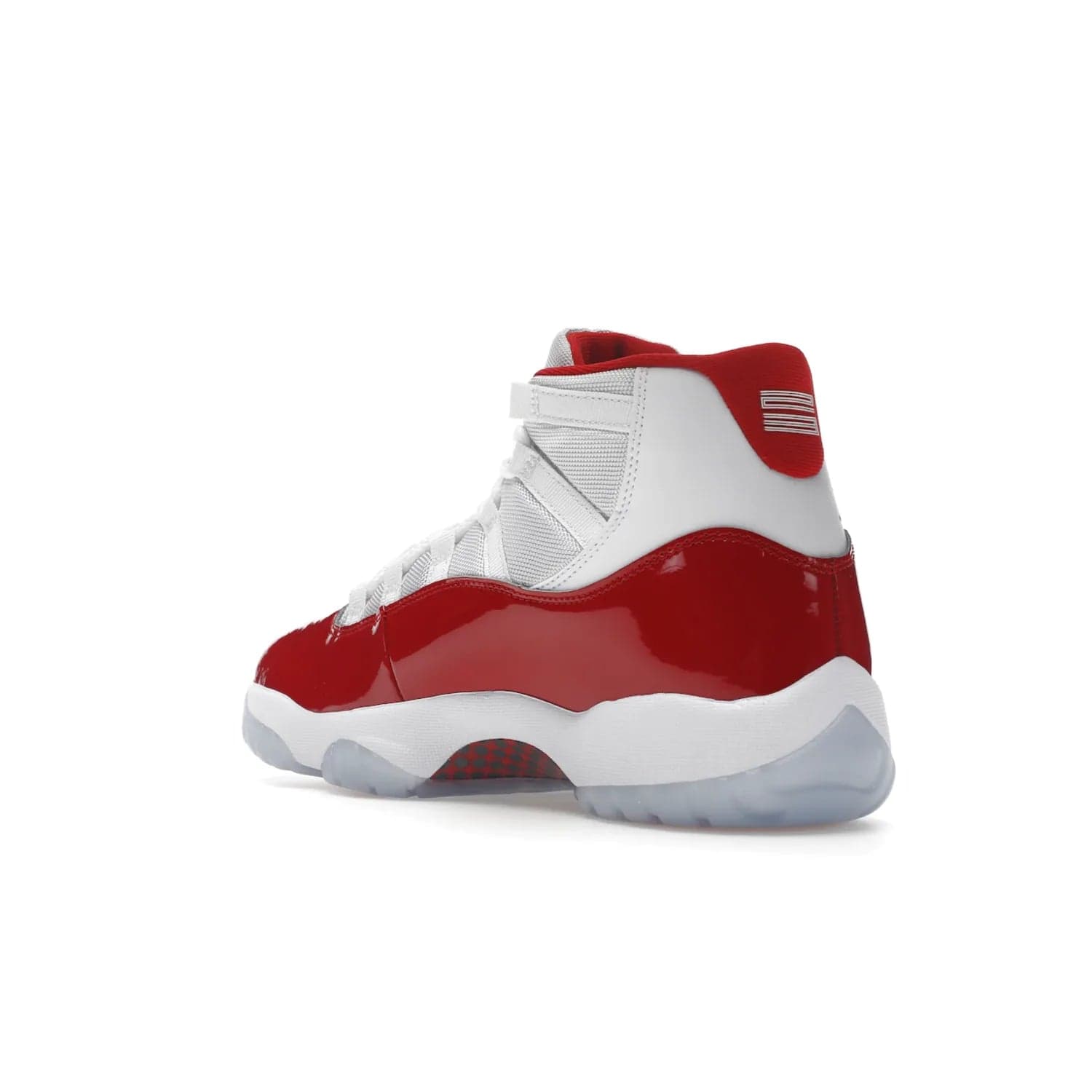 Jordan 11 Retro Cherry (2022) - Image 24 - Only at www.BallersClubKickz.com - The Air Jordan 11 Cherry features classic patent leather with Cherry red accents, icy blue outsole, and debossed 23 on the heel tab. Refresh your sneaker game with this iconic update, available December 10, 2022.