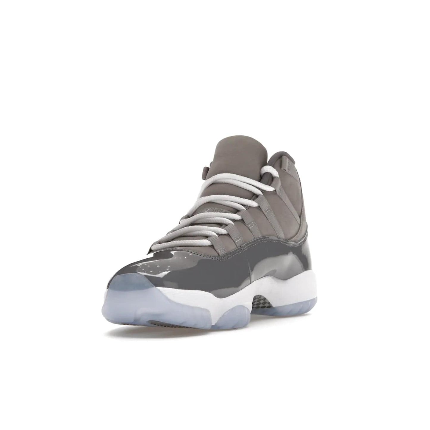 Jordan 11 Retro Cool Grey (2021) - Image 13 - Only at www.BallersClubKickz.com - Shop the Air Jordan 11 Retro Cool Grey (2021) for a must-have sneaker with a Cool Grey Durabuck upper, patent leather overlays, signature Jumpman embroidery, a white midsole, icy blue translucent outsole, and Multi-Color accents.  Released in December 2021 for $225.