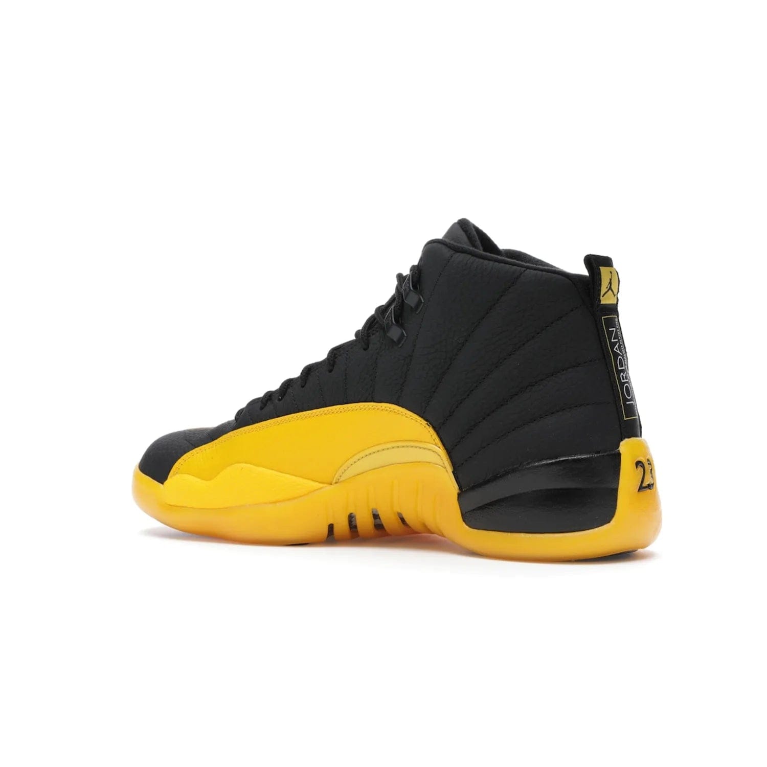 Jordan 12 Retro Black University Gold - Image 22 - Only at www.BallersClubKickz.com - This Jordan 12 Retro features a black tumbled leather upper and University Gold accents for a modern twist. Boasting Jordan "Two Three" branding and a yellow sole, these shoes will elevate your wardrobe. Fresh, sleek, and one of a kind - the Jordan 12 University Gold is your summer sneaker.