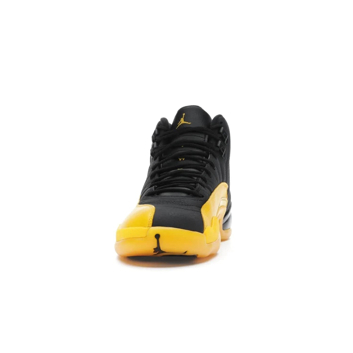 Jordan 12 Retro Black University Gold - Image 11 - Only at www.BallersClubKickz.com - This Jordan 12 Retro features a black tumbled leather upper and University Gold accents for a modern twist. Boasting Jordan "Two Three" branding and a yellow sole, these shoes will elevate your wardrobe. Fresh, sleek, and one of a kind - the Jordan 12 University Gold is your summer sneaker.