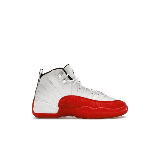 Jordan 12 Retro Cherry (2023) (GS) - Image 1 - Only at www.BallersClubKickz.com - Grab the Jordan 12 Retro Cherry (2023) (GS) and show off your signature style with these iconic kicks. Dressed in White, Black and Varsity Red, these timeless kicks are sure to turn heads. Available October 28, 2023.