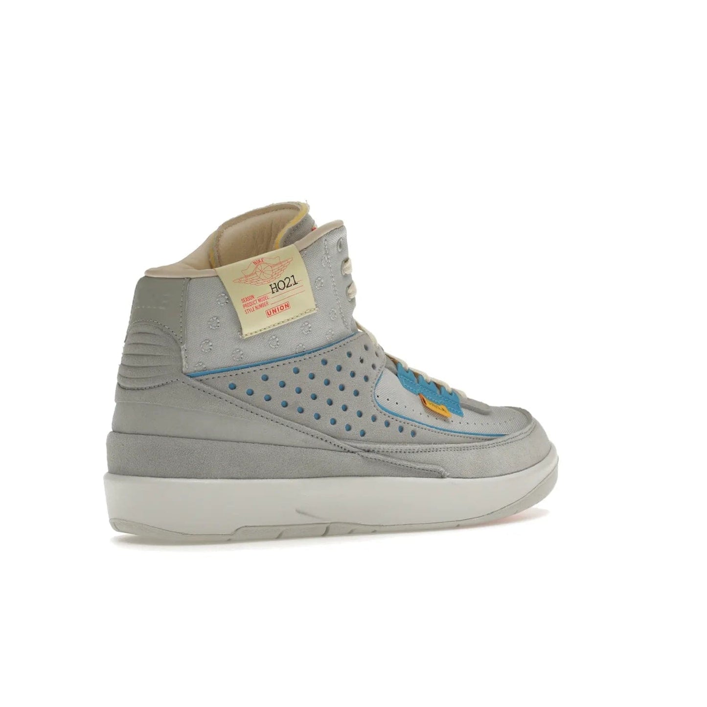 Jordan 2 Retro SP Union Grey Fog - Image 33 - Only at www.BallersClubKickz.com - Introducing the Air Jordan 2 Retro SP Union Grey Fog. This intricate sneaker design features a grey canvas upper with light blue eyelets, eyestay patches, and piping, plus custom external tags. Dropping in April 2022, this exclusive release offers a worn-in look and feel.