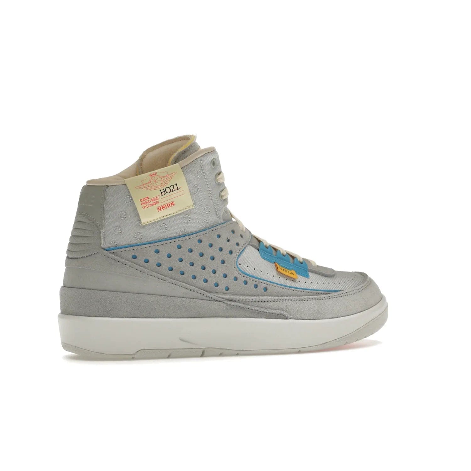 Jordan 2 Retro SP Union Grey Fog - Image 34 - Only at www.BallersClubKickz.com - Introducing the Air Jordan 2 Retro SP Union Grey Fog. This intricate sneaker design features a grey canvas upper with light blue eyelets, eyestay patches, and piping, plus custom external tags. Dropping in April 2022, this exclusive release offers a worn-in look and feel.