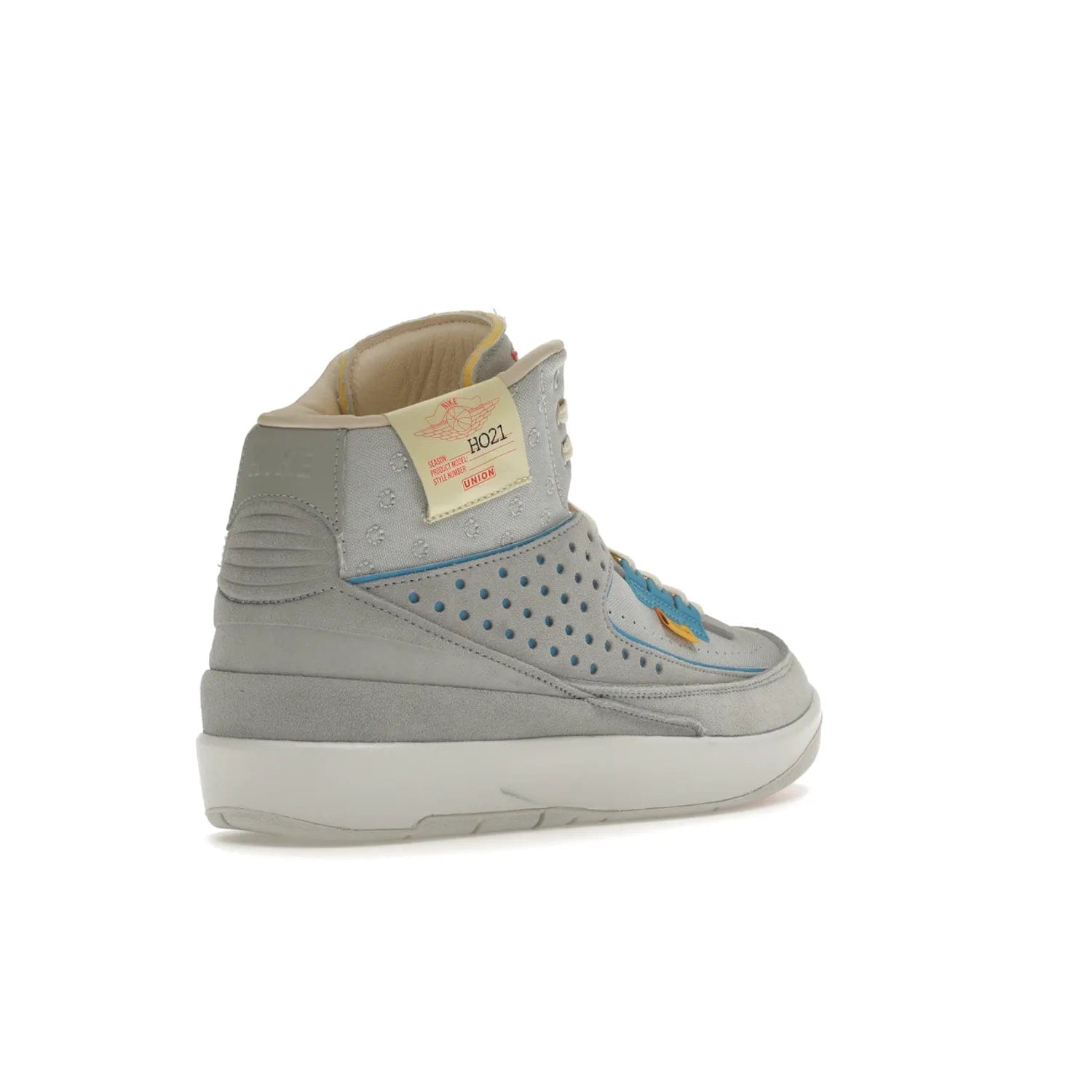 Jordan 2 Retro SP Union Grey Fog - Image 32 - Only at www.BallersClubKickz.com - Introducing the Air Jordan 2 Retro SP Union Grey Fog. This intricate sneaker design features a grey canvas upper with light blue eyelets, eyestay patches, and piping, plus custom external tags. Dropping in April 2022, this exclusive release offers a worn-in look and feel.