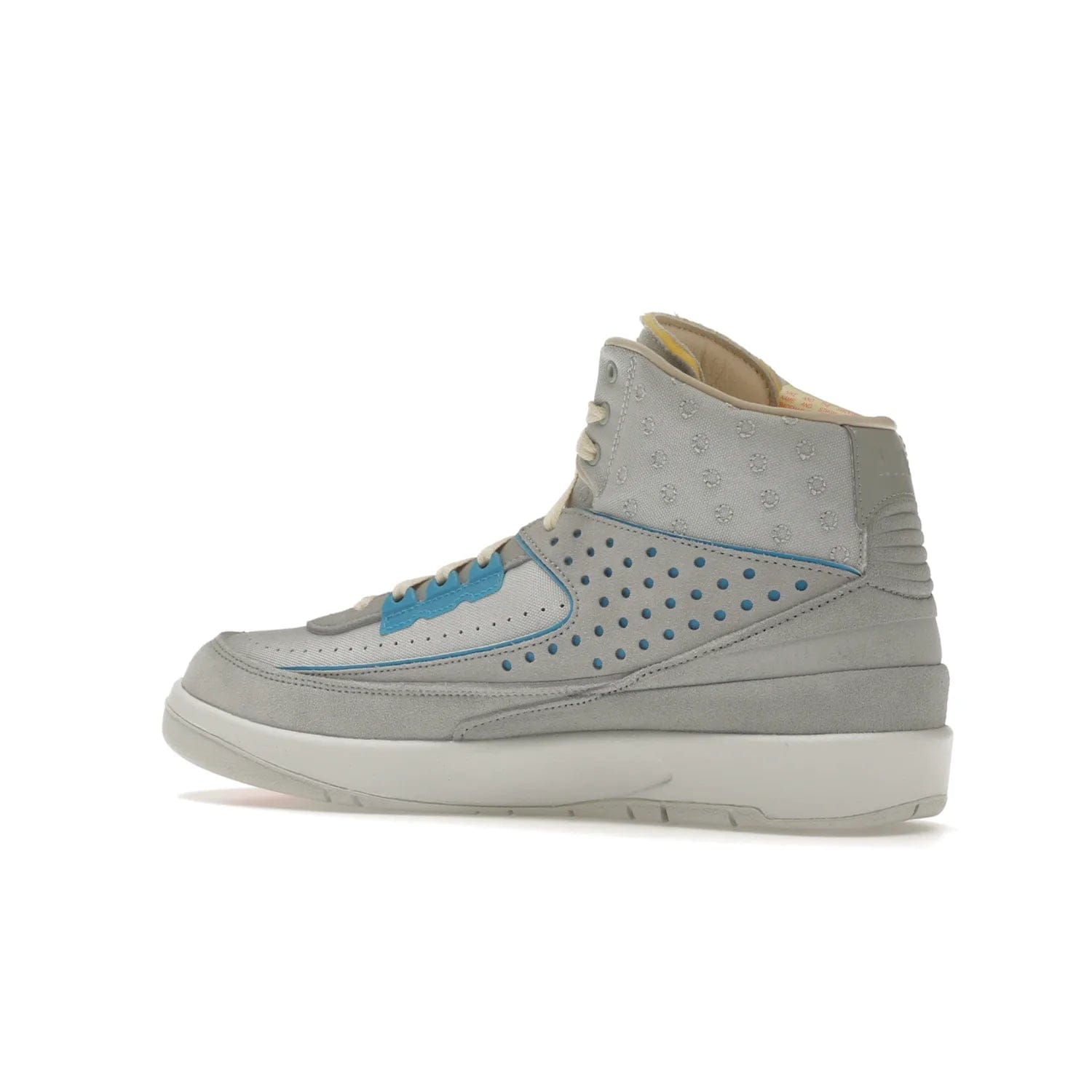 Jordan 2 Retro SP Union Grey Fog - Image 22 - Only at www.BallersClubKickz.com - Introducing the Air Jordan 2 Retro SP Union Grey Fog. This intricate sneaker design features a grey canvas upper with light blue eyelets, eyestay patches, and piping, plus custom external tags. Dropping in April 2022, this exclusive release offers a worn-in look and feel.