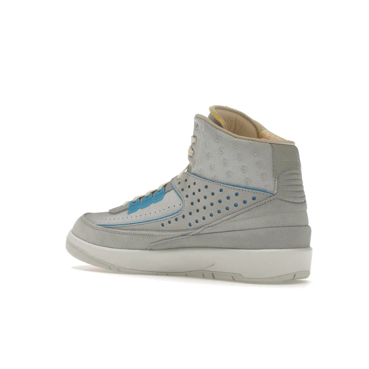 Jordan 2 Retro SP Union Grey Fog - Image 23 - Only at www.BallersClubKickz.com - Introducing the Air Jordan 2 Retro SP Union Grey Fog. This intricate sneaker design features a grey canvas upper with light blue eyelets, eyestay patches, and piping, plus custom external tags. Dropping in April 2022, this exclusive release offers a worn-in look and feel.
