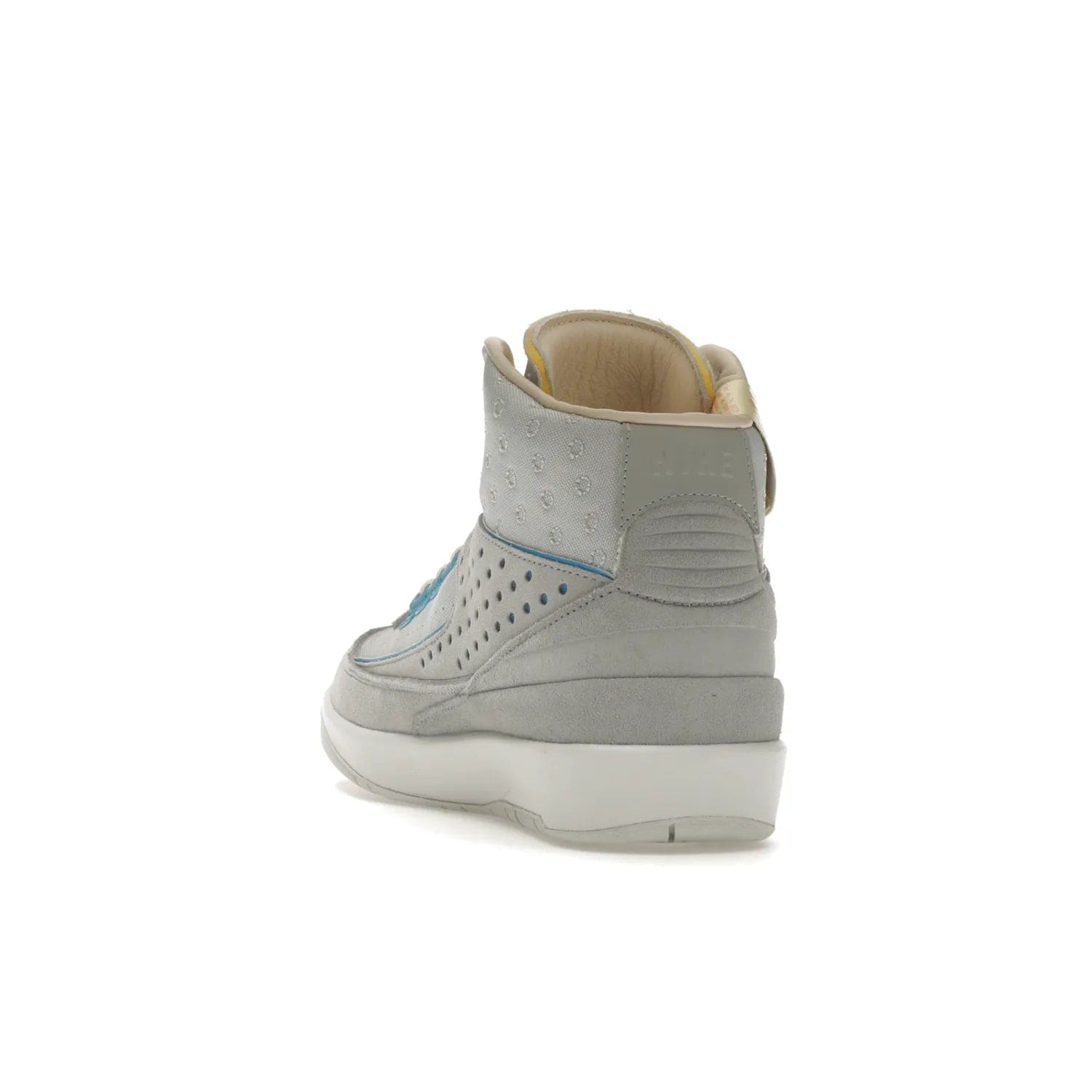 Jordan 2 Retro SP Union Grey Fog - Image 26 - Only at www.BallersClubKickz.com - Introducing the Air Jordan 2 Retro SP Union Grey Fog. This intricate sneaker design features a grey canvas upper with light blue eyelets, eyestay patches, and piping, plus custom external tags. Dropping in April 2022, this exclusive release offers a worn-in look and feel.