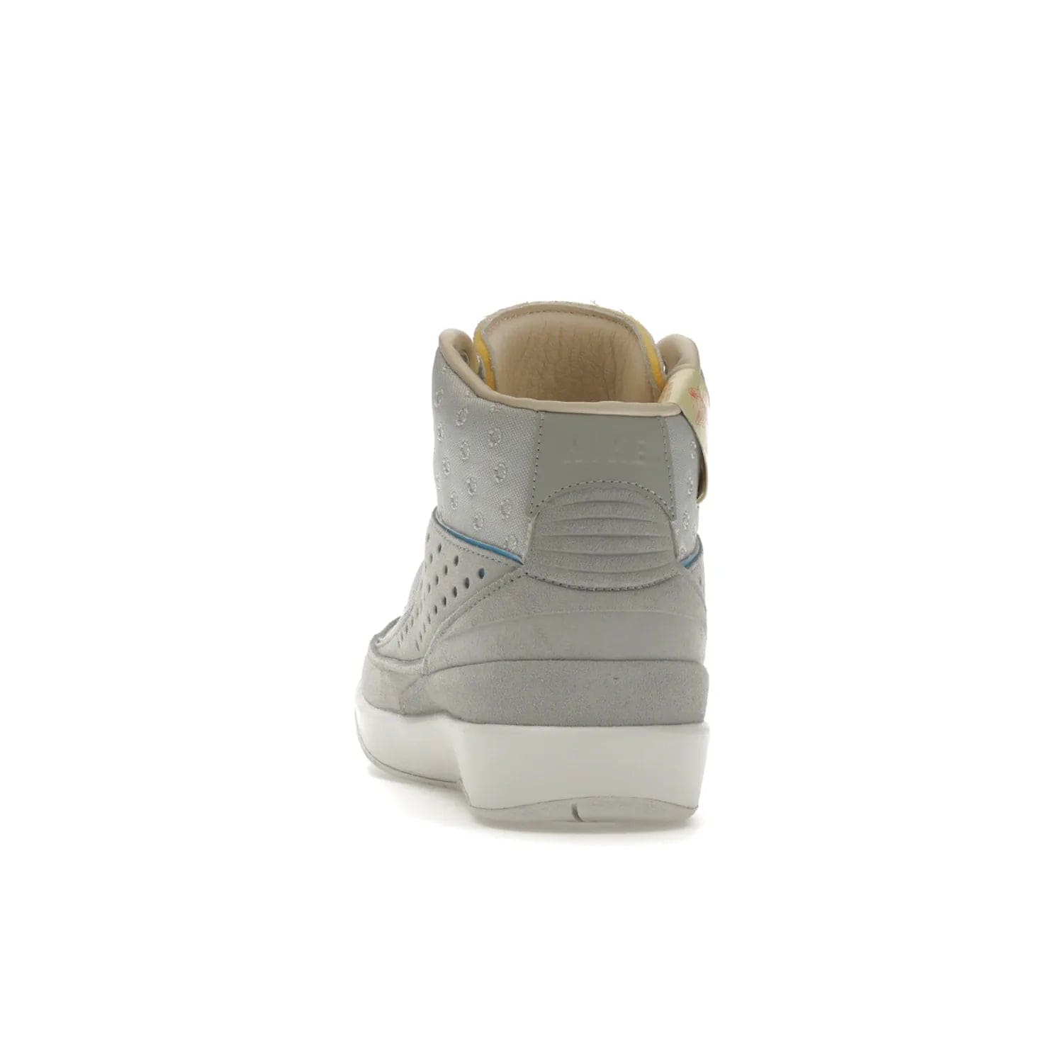 Jordan 2 Retro SP Union Grey Fog - Image 27 - Only at www.BallersClubKickz.com - Introducing the Air Jordan 2 Retro SP Union Grey Fog. This intricate sneaker design features a grey canvas upper with light blue eyelets, eyestay patches, and piping, plus custom external tags. Dropping in April 2022, this exclusive release offers a worn-in look and feel.