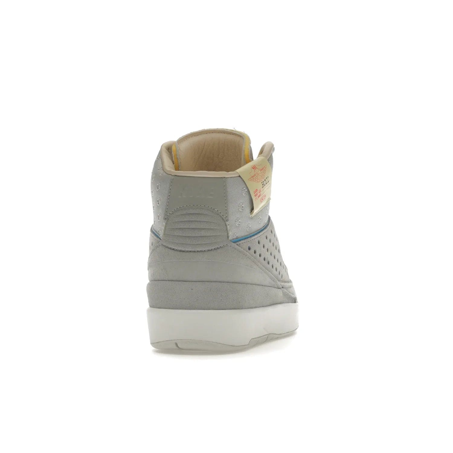 Jordan 2 Retro SP Union Grey Fog - Image 29 - Only at www.BallersClubKickz.com - Introducing the Air Jordan 2 Retro SP Union Grey Fog. This intricate sneaker design features a grey canvas upper with light blue eyelets, eyestay patches, and piping, plus custom external tags. Dropping in April 2022, this exclusive release offers a worn-in look and feel.