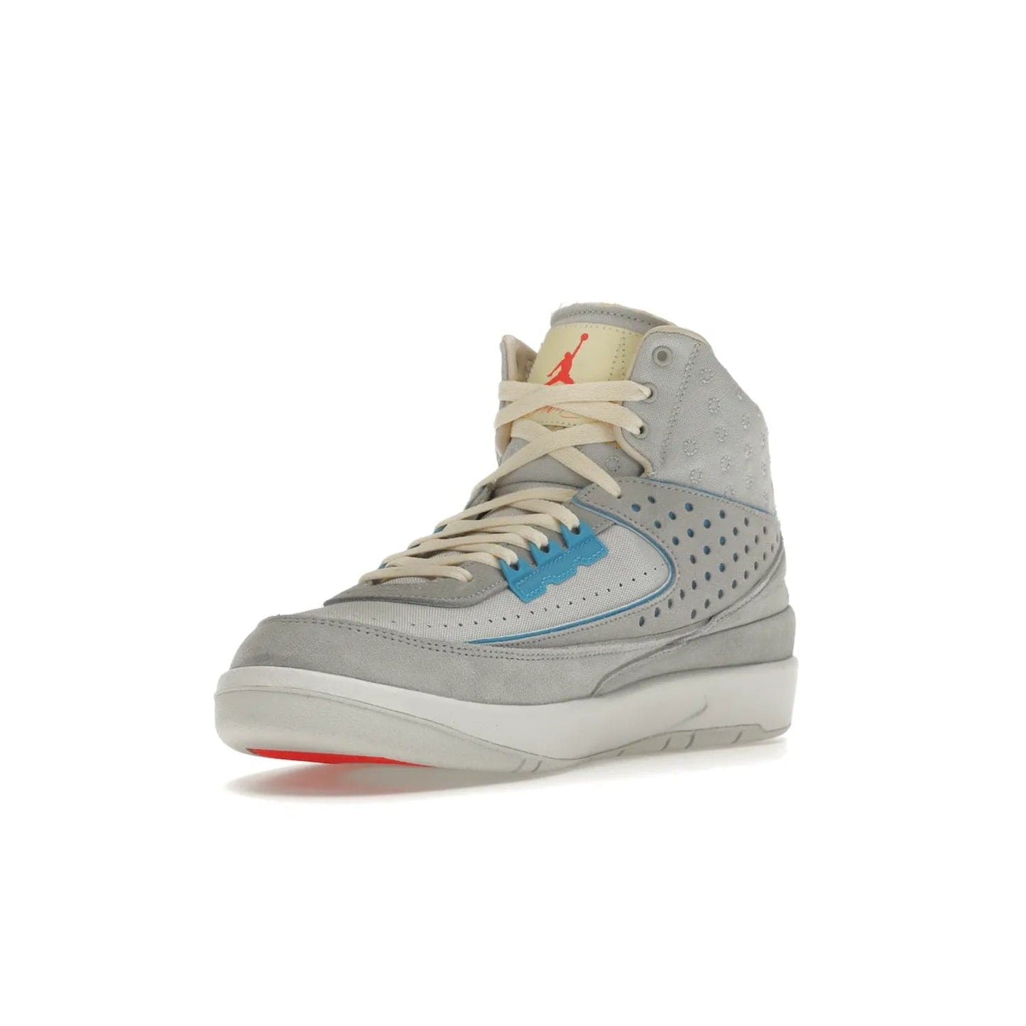 Jordan 2 Retro SP Union Grey Fog - Image 14 - Only at www.BallersClubKickz.com - Introducing the Air Jordan 2 Retro SP Union Grey Fog. This intricate sneaker design features a grey canvas upper with light blue eyelets, eyestay patches, and piping, plus custom external tags. Dropping in April 2022, this exclusive release offers a worn-in look and feel.