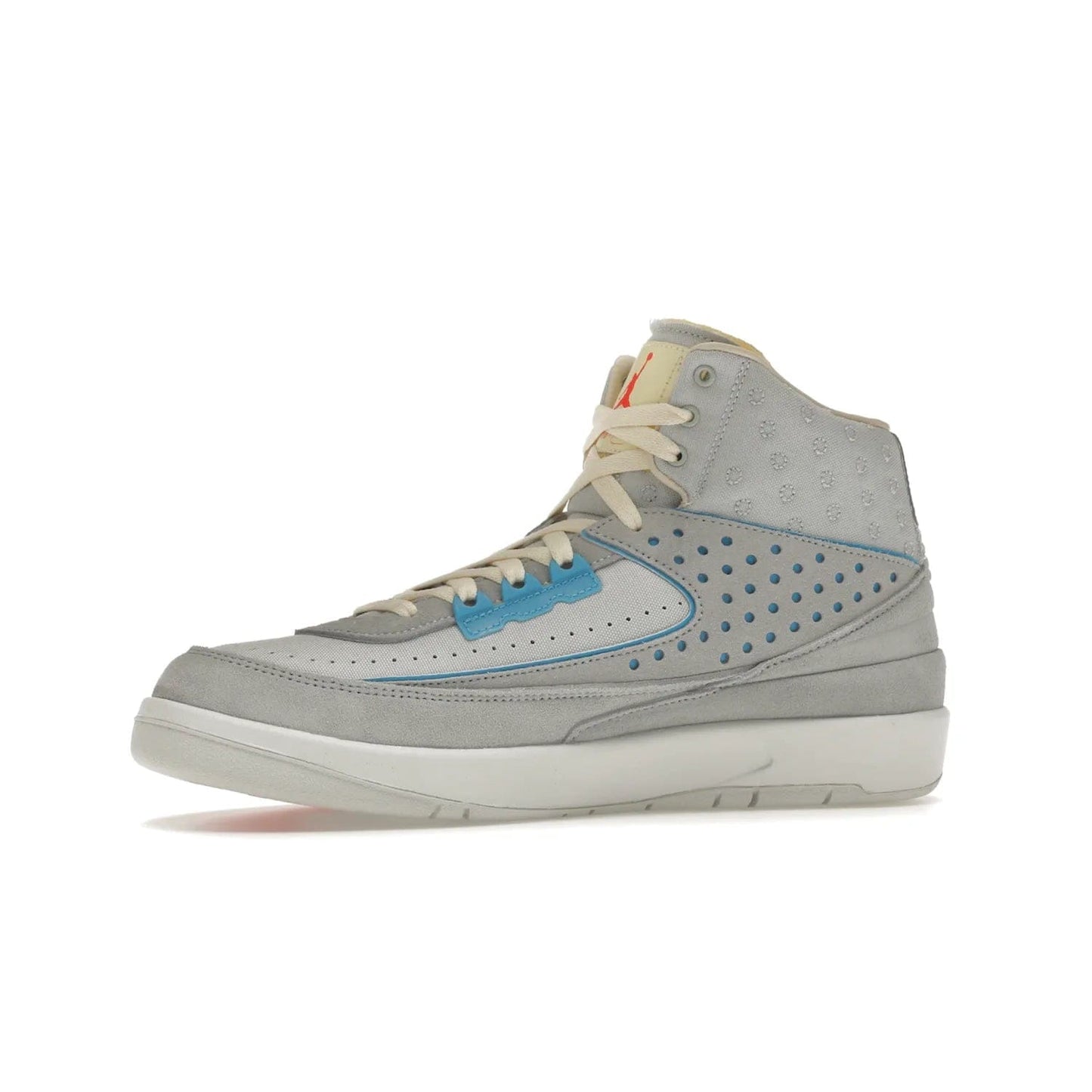 Jordan 2 Retro SP Union Grey Fog - Image 17 - Only at www.BallersClubKickz.com - Introducing the Air Jordan 2 Retro SP Union Grey Fog. This intricate sneaker design features a grey canvas upper with light blue eyelets, eyestay patches, and piping, plus custom external tags. Dropping in April 2022, this exclusive release offers a worn-in look and feel.