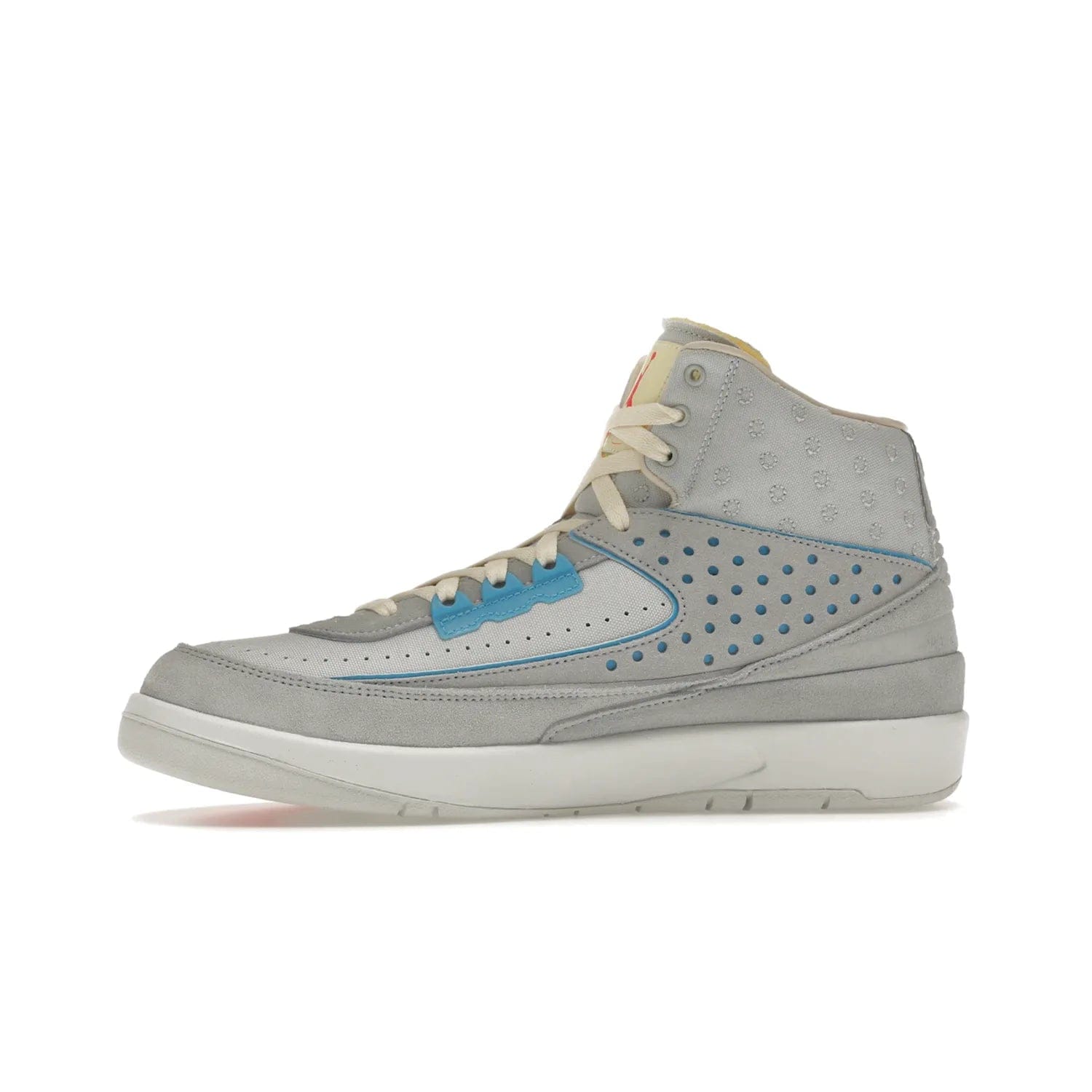 Jordan 2 Retro SP Union Grey Fog - Image 18 - Only at www.BallersClubKickz.com - Introducing the Air Jordan 2 Retro SP Union Grey Fog. This intricate sneaker design features a grey canvas upper with light blue eyelets, eyestay patches, and piping, plus custom external tags. Dropping in April 2022, this exclusive release offers a worn-in look and feel.
