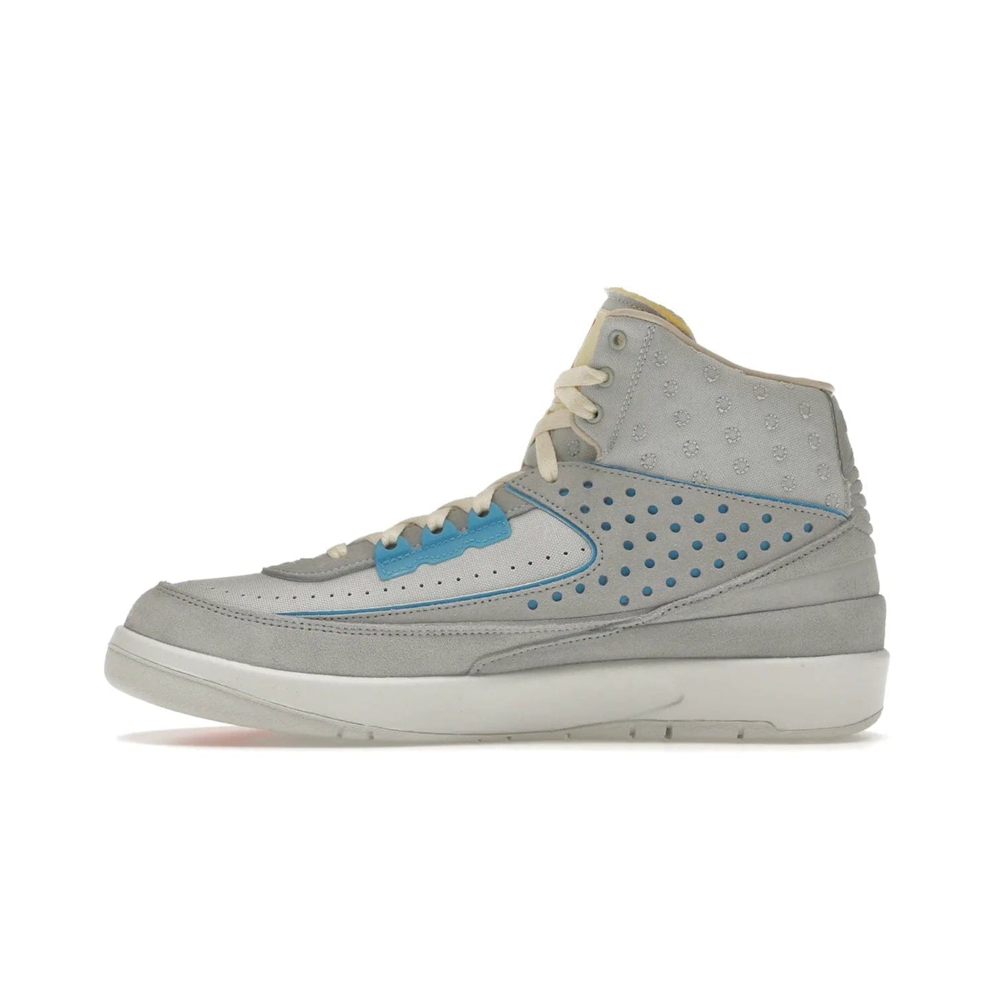 Jordan 2 Retro SP Union Grey Fog - Image 19 - Only at www.BallersClubKickz.com - Introducing the Air Jordan 2 Retro SP Union Grey Fog. This intricate sneaker design features a grey canvas upper with light blue eyelets, eyestay patches, and piping, plus custom external tags. Dropping in April 2022, this exclusive release offers a worn-in look and feel.